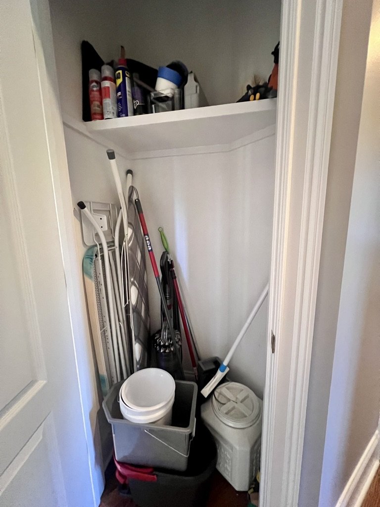 Cluttered entryway table in a New Jersey home before a Make Space Organizing session