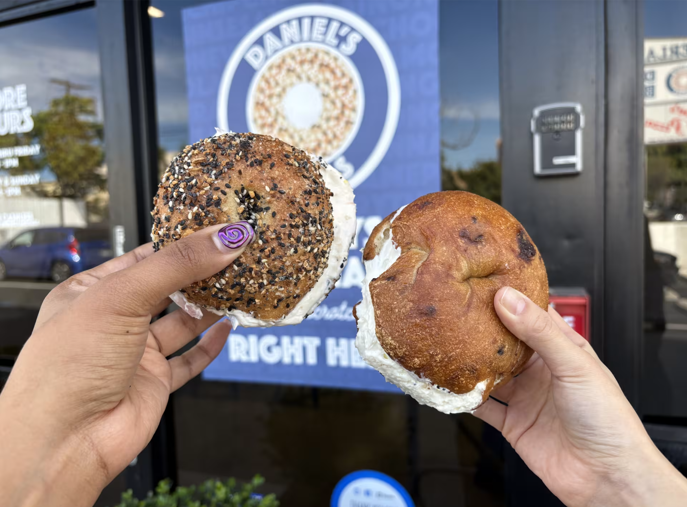 A photo of 2 bagels with cream cheese.