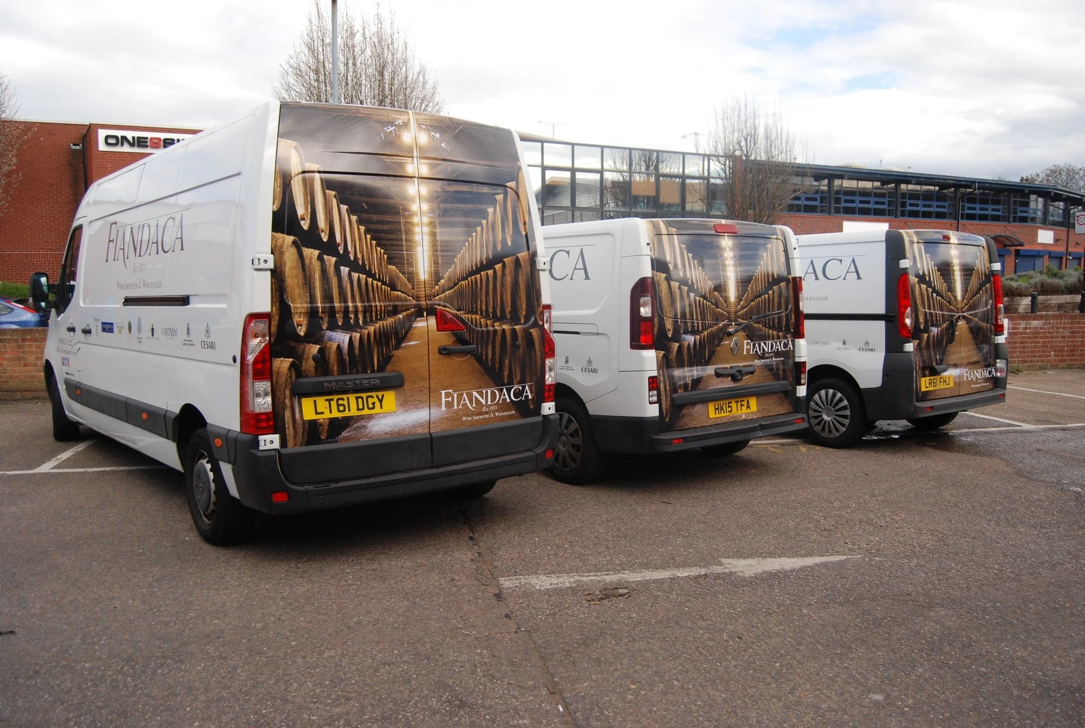 Not a wine cellar. Just very good wrapping. Looking back at this fleet livery for Fiandaca Wine Importers.

It required the same barrel cellar image to read as a single continuous scene across three completely different vehicle profiles. 

Precise co