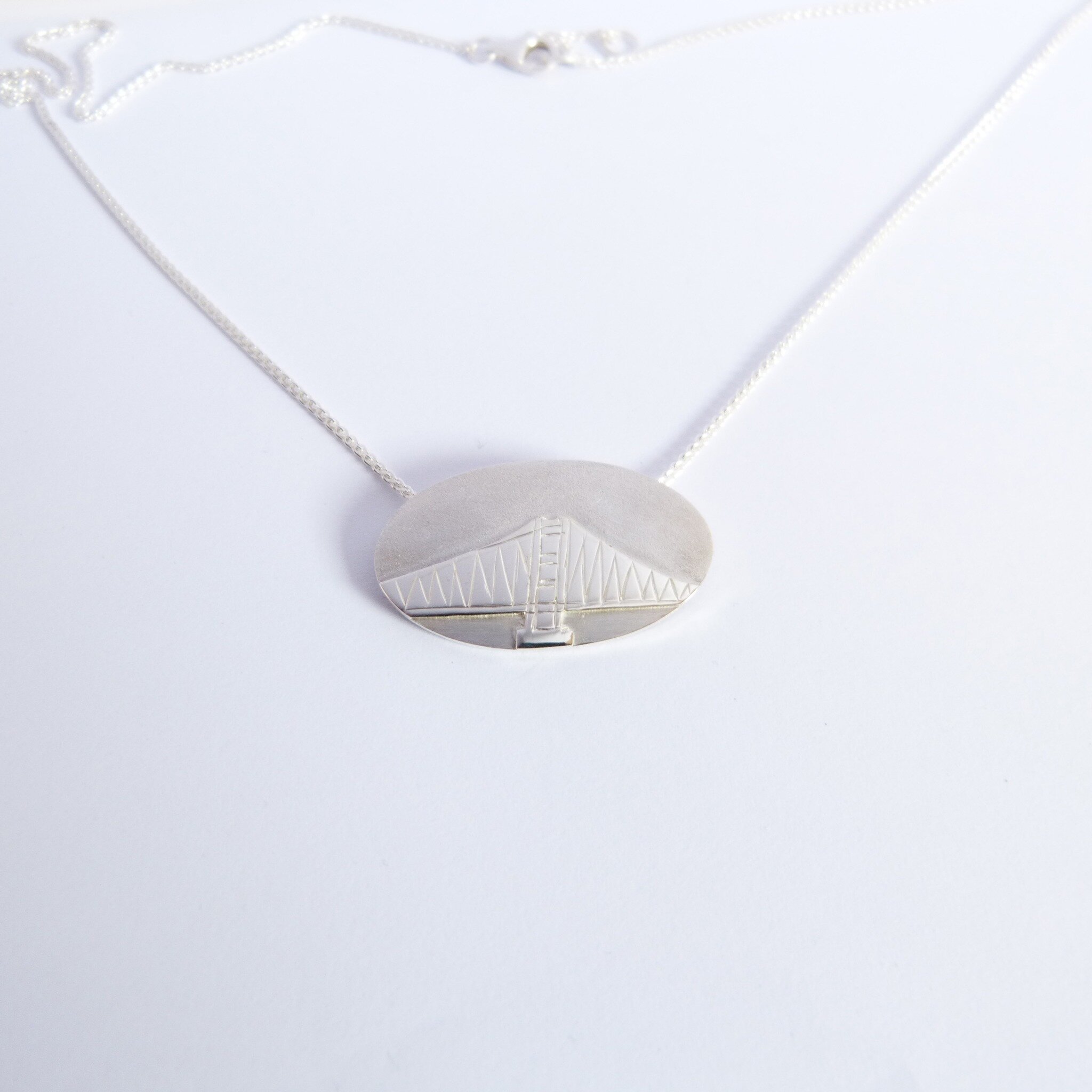 I may not be taking on new orders right now but jewellery is still being created and new pieces are leaving my studio on a weekly basis!
This Humber bridge necklace was commissioned by a previous wedding ring client of mine. This was a special birthd