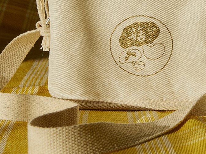 Close up of logo on fabric cooler bag