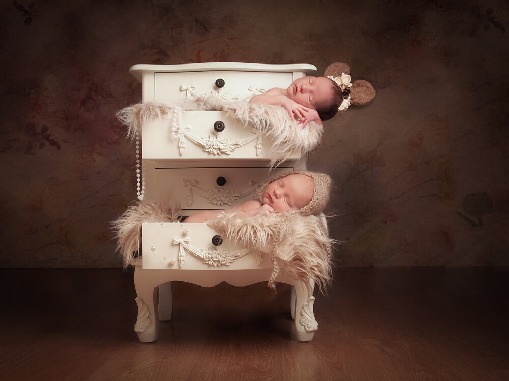 With over 20 years as a professional photographer, it's an absolute treat when twins come to visit us at our Derbyshire studio for their newborn art photographs.