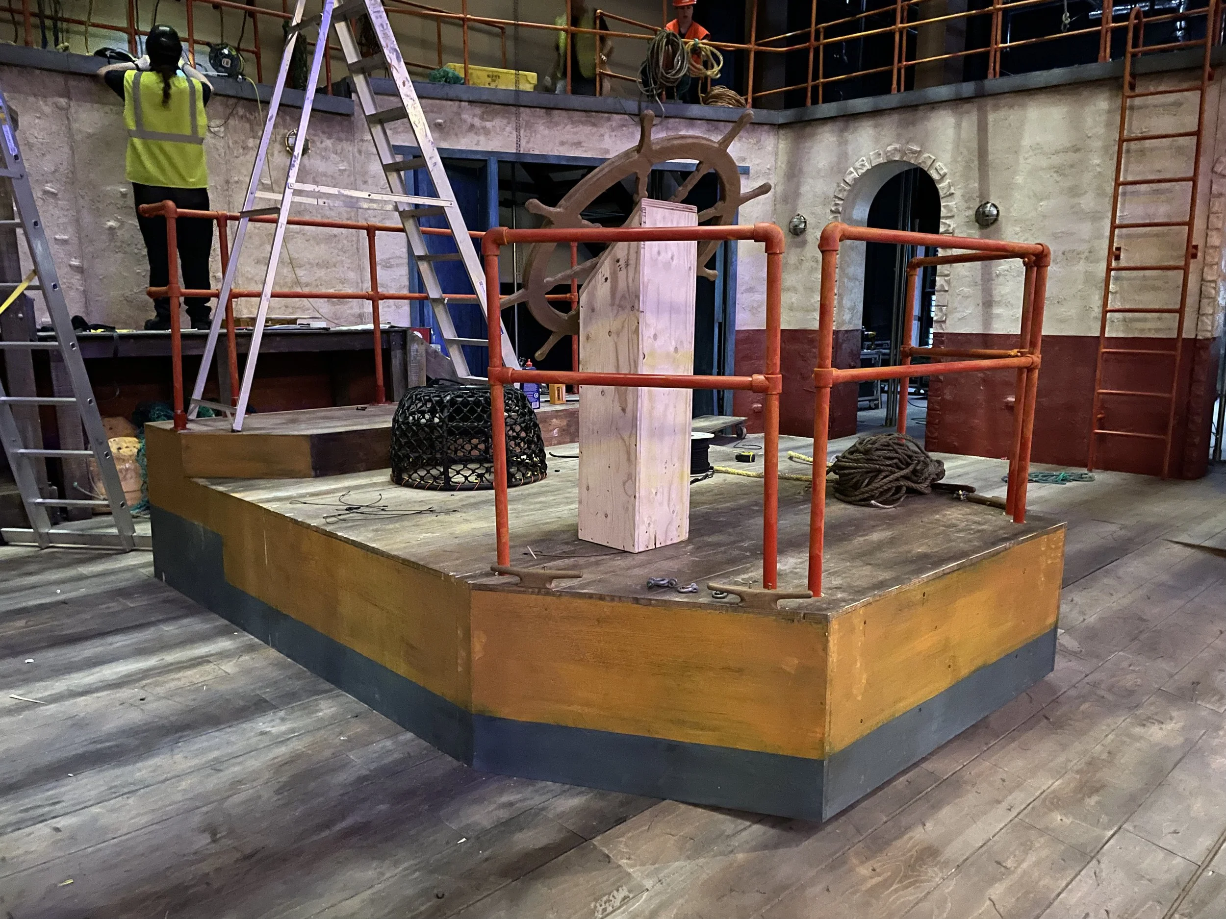 A construction picture of a female carpenter at the fit up in the Hall for Cornwall for Fisherman's Friend.