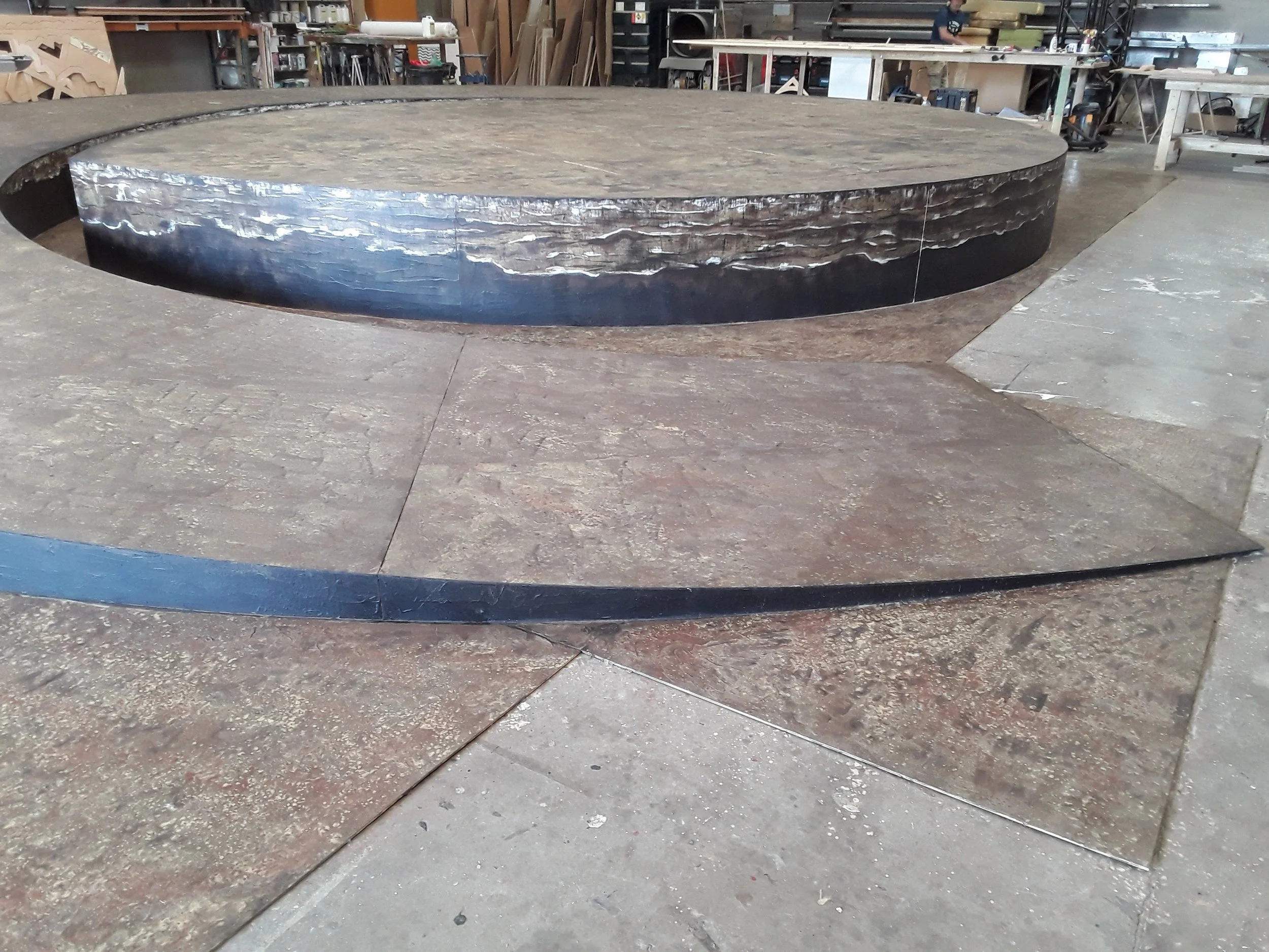 This is the circular swirling platform stage that was build for L'Orfeo Opera. With stone effect finishes and darkened surfaces