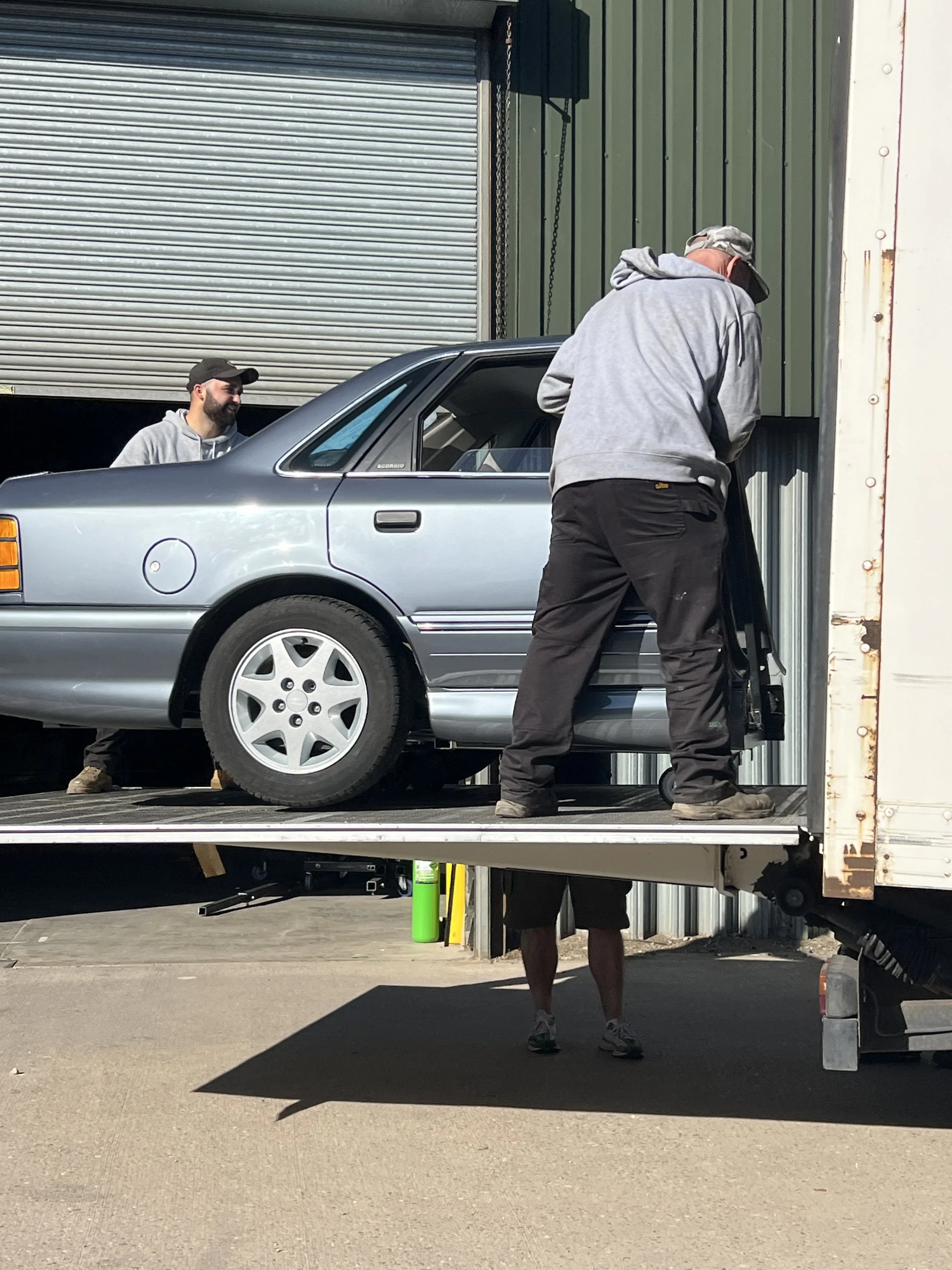 Half a car on a tail lift