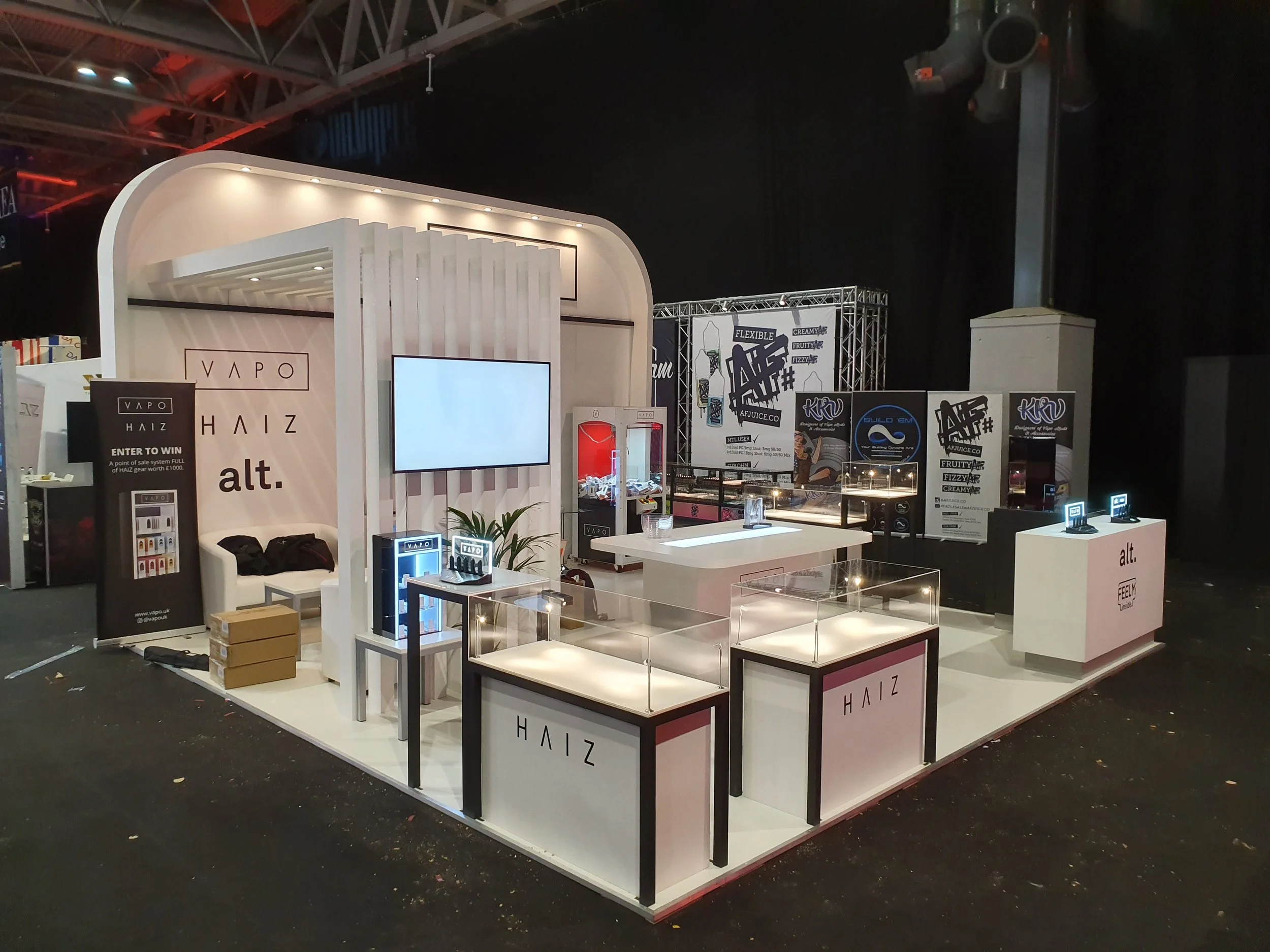 This is an product launch for a Vape company at the National Exhibition Centre in Birmingham.  A built exhibition stand with display counters, seating, walls, lighting and flooring all to brand for the stand designer.
