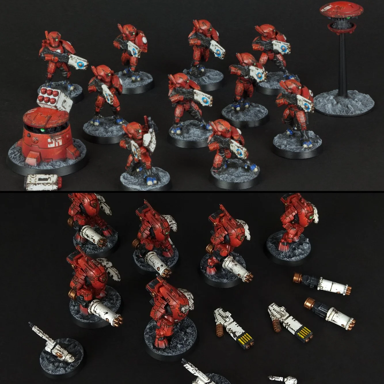 Collection of painted miniature figures of red armored soldiers with weapons, set on round bases against a black background.