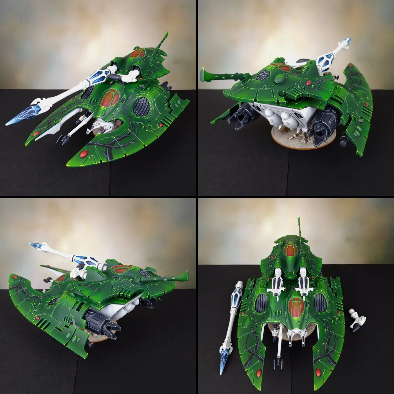 A model spaceship painted green with intricate black and red details, shown from four angles. It has a sleek, angular design with large wings, a white and blue long weapon mounted on top, and various mechanical parts visible underneath.