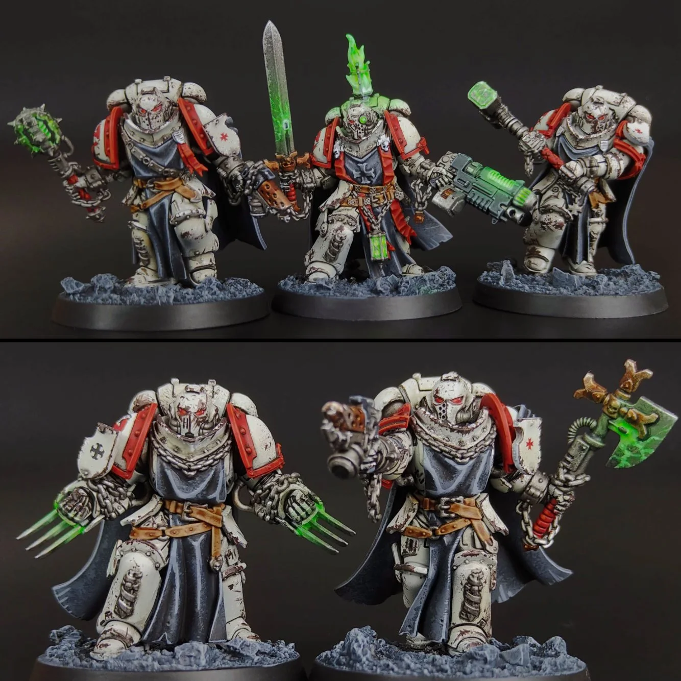 Four miniature figures of space marines in white armor with red and black accents, holding weapons, standing on rocky bases against a black background. The top row shows three marines with one holding a chainsword, one with a bolter, and one with a p