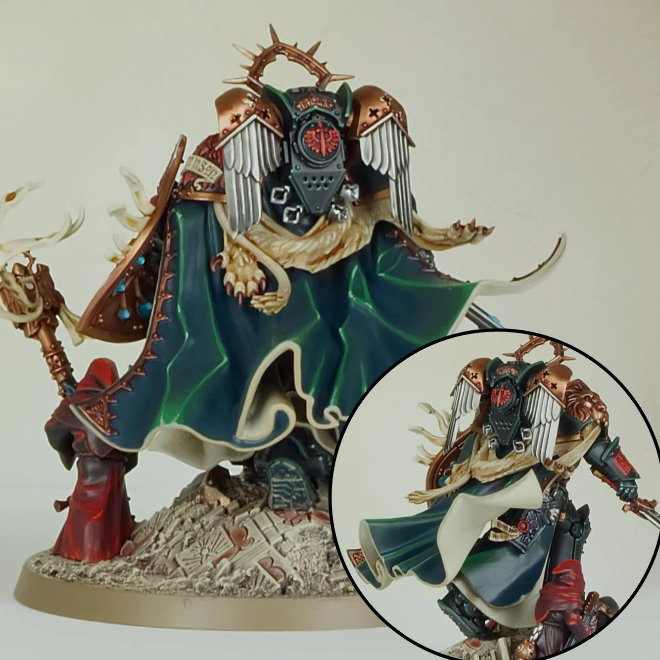 Detailed miniature figure of a warrior with a mechanical faceplate, wearing ornate armor with a flowing cape, standing on a textured base.
