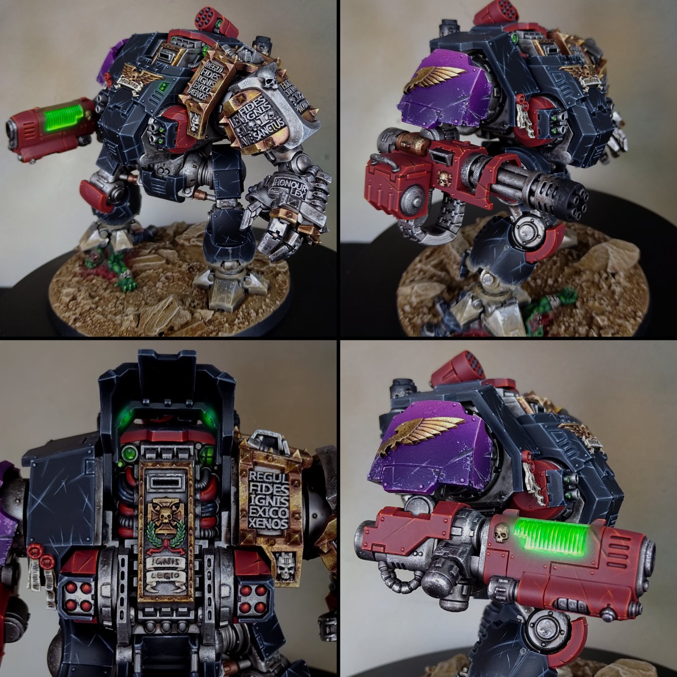 A detailed miniature model of a sci-fi armored robot with a black, red, and purple color scheme, standing on a textured base that resembles dirt and rocks, shown from multiple angles.