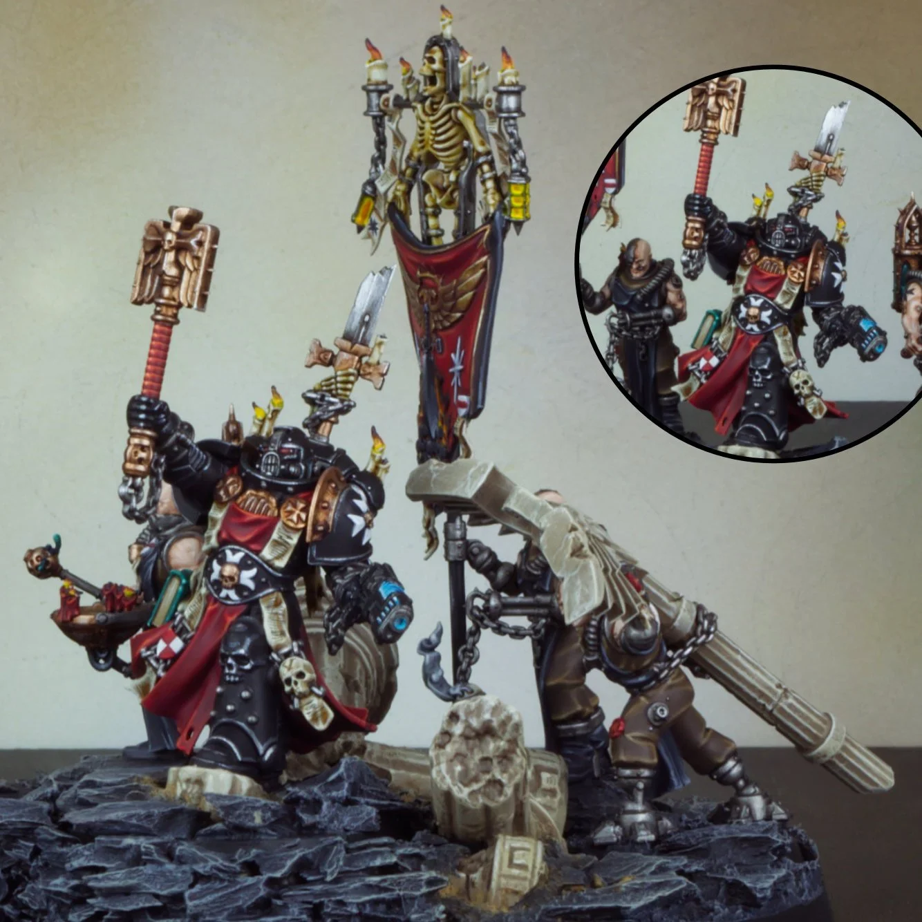 Detailed painted miniature figurines of sci-fi warriors with books and weapons, displayed on a rocky base.