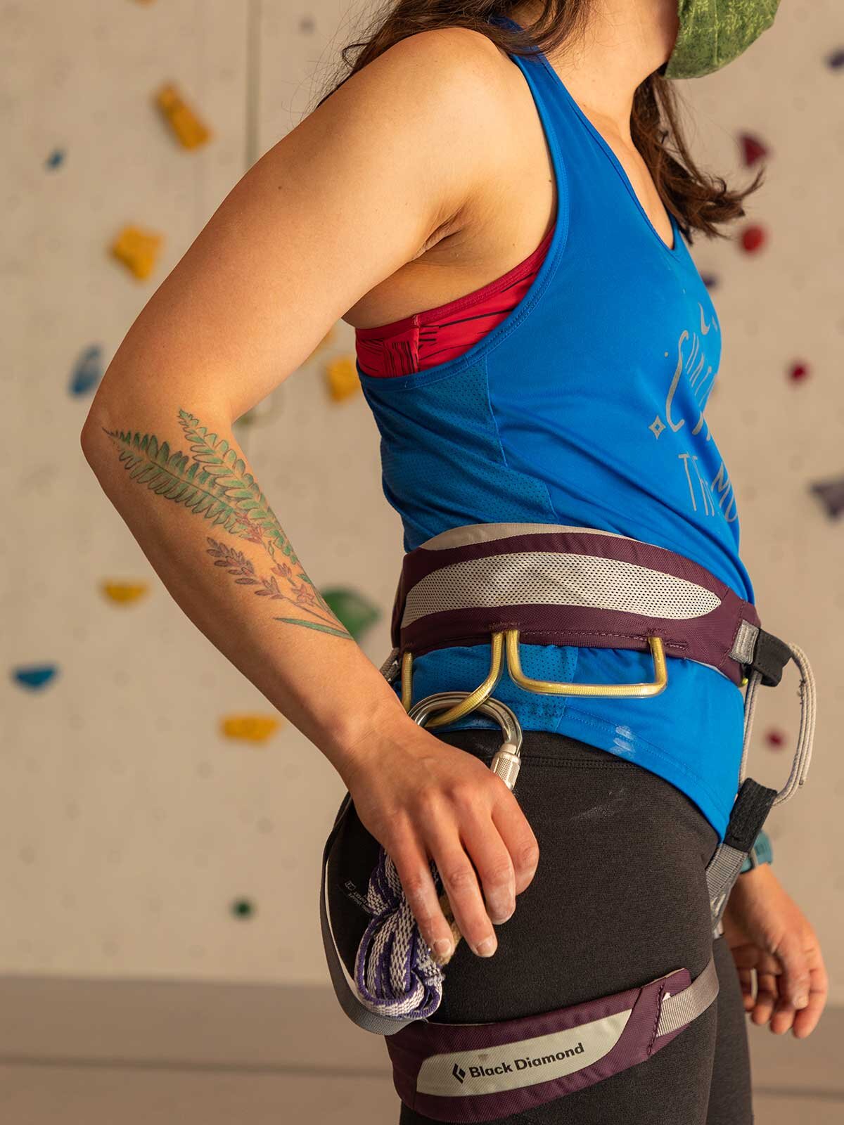 Detailed photo of a woman's arm tattoo. She is in rock climbing gear. Upstate New York Photographer.