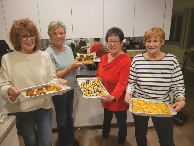 Rugelach Workshop: women holding trays of rugelach