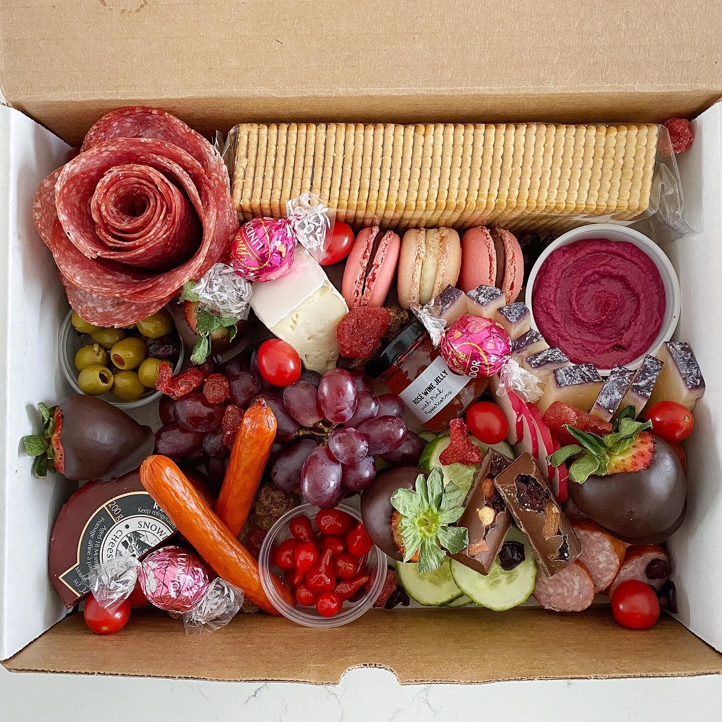 Valentine&rsquo;s Day Boxes are here!⁣
⁣
Treat your loved one to a beautiful and delicious box of all the treats &ndash; sweet and savoury.⁣
⁣
Includes:⁣
⁣
&bull;3 meats (including a salami rose)⁣
&bull;3 cheeses⁣
&bull;Crackers⁣
&bull;Variety of veg