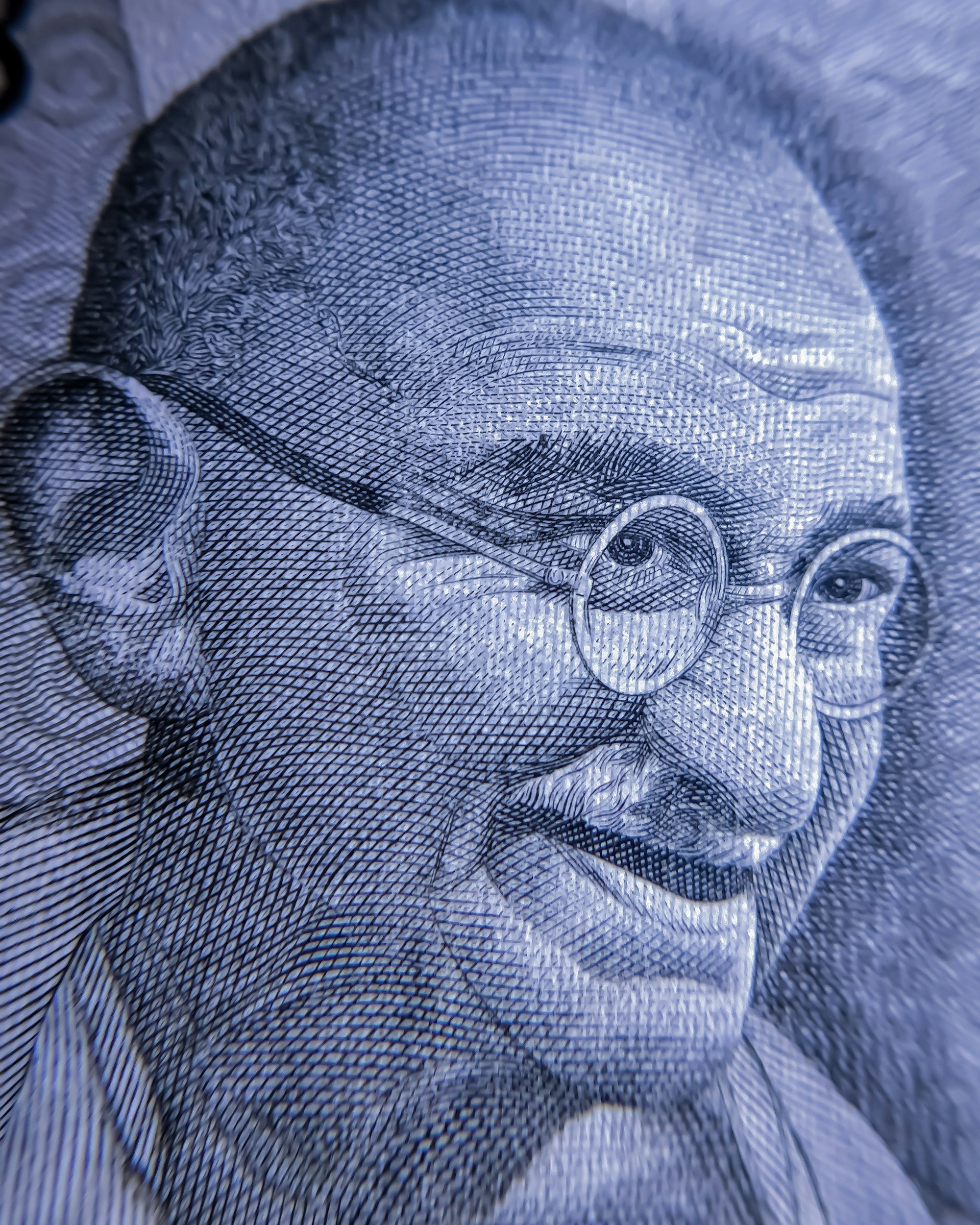 black and white photo of Mahatma Gandhi as an older gentleman