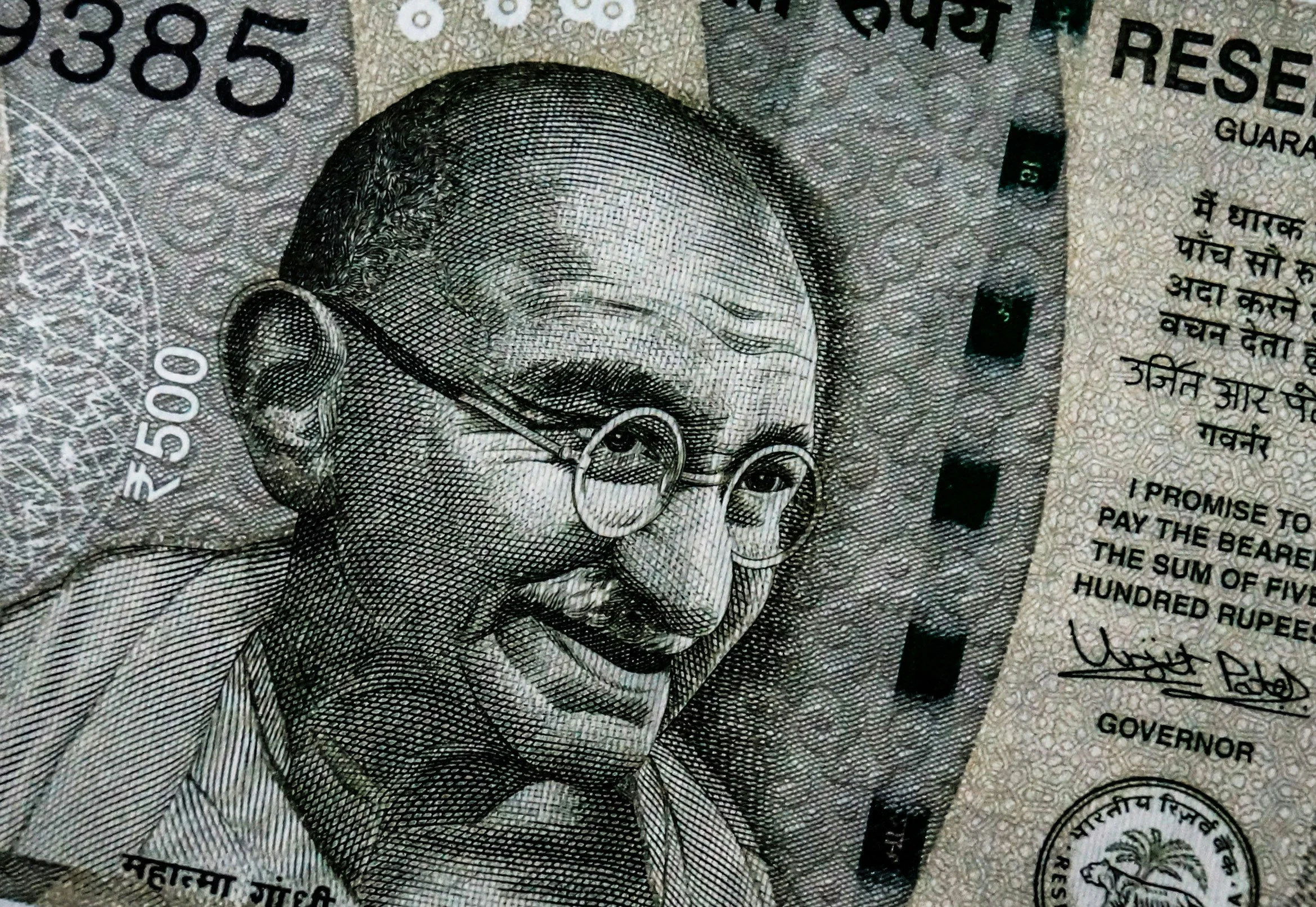 black and white sketch of Mahatma Gandhi as an older man