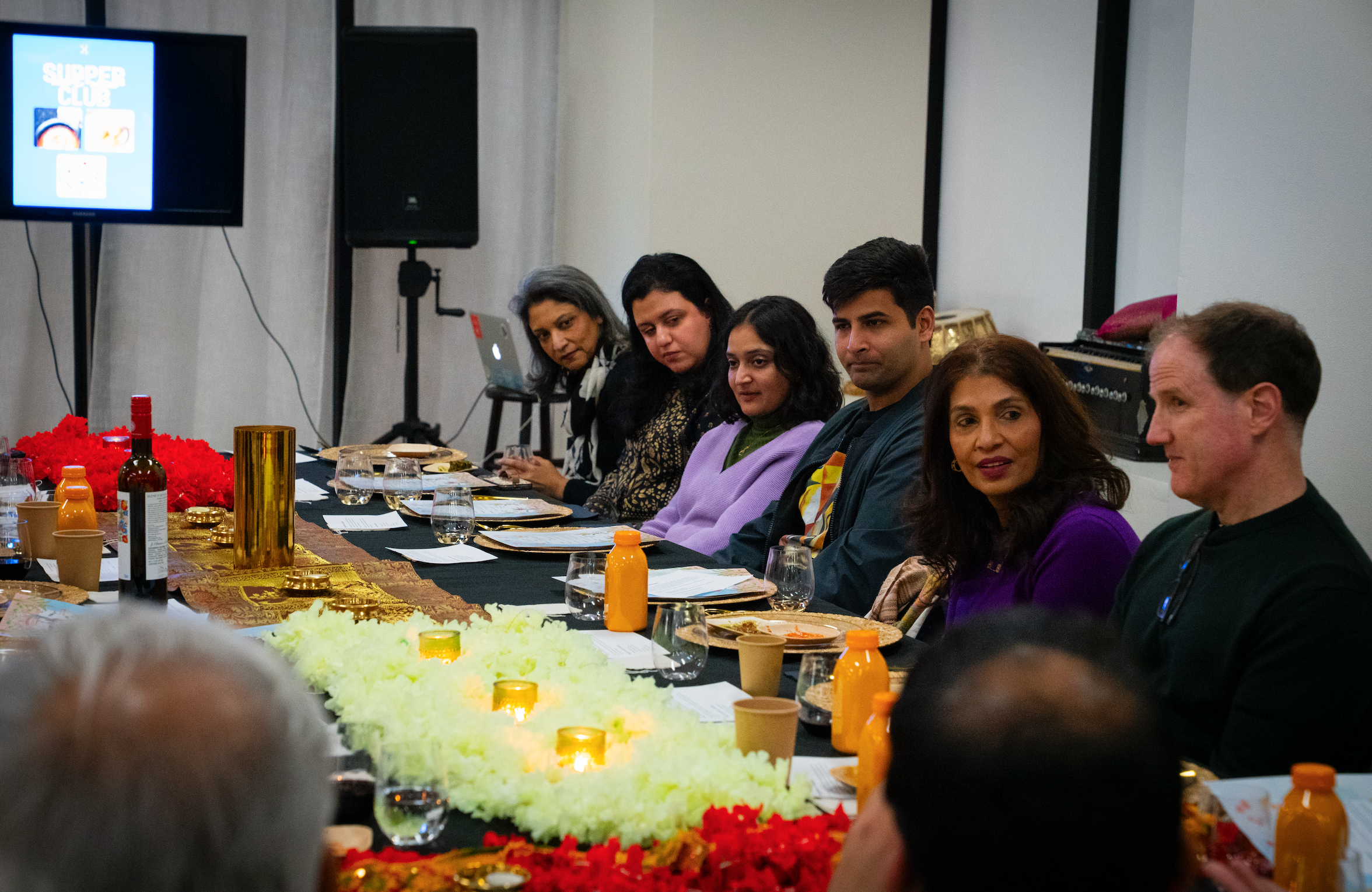 Guests conversing during dinner