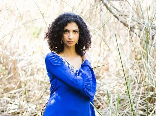 Anjali Ray photo in a garden wearing blue blouse