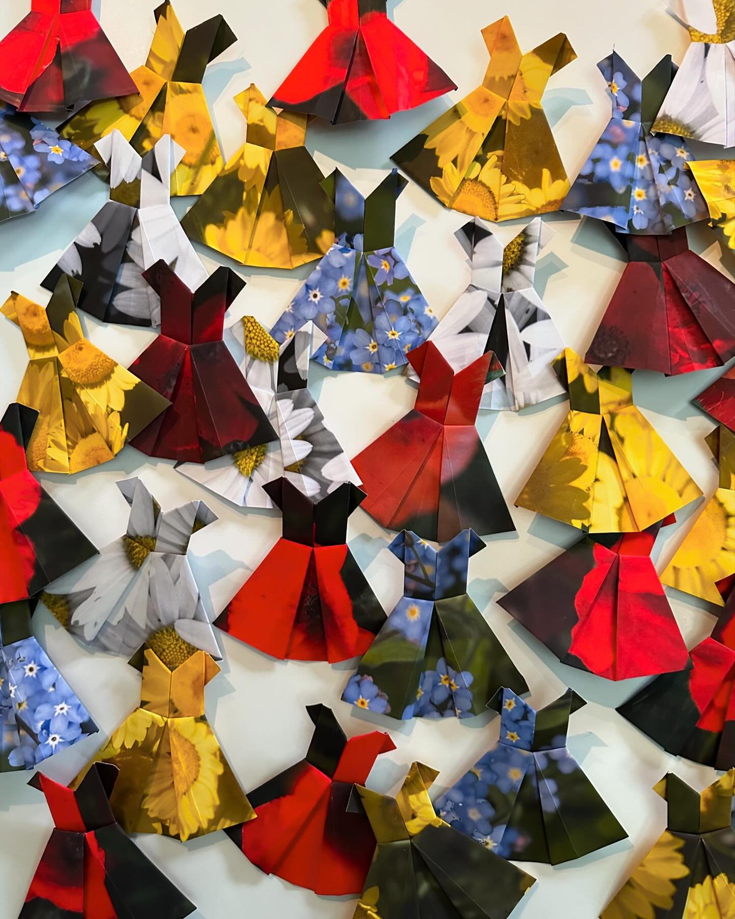 It began as a simple exercise in keeping my hands moving. A little something - just for fun. I folded one origami paper dress and then another. And before I knew it - I&rsquo;d re-immersed myself in my mother&rsquo;s garden&hellip;re-imagining the ge