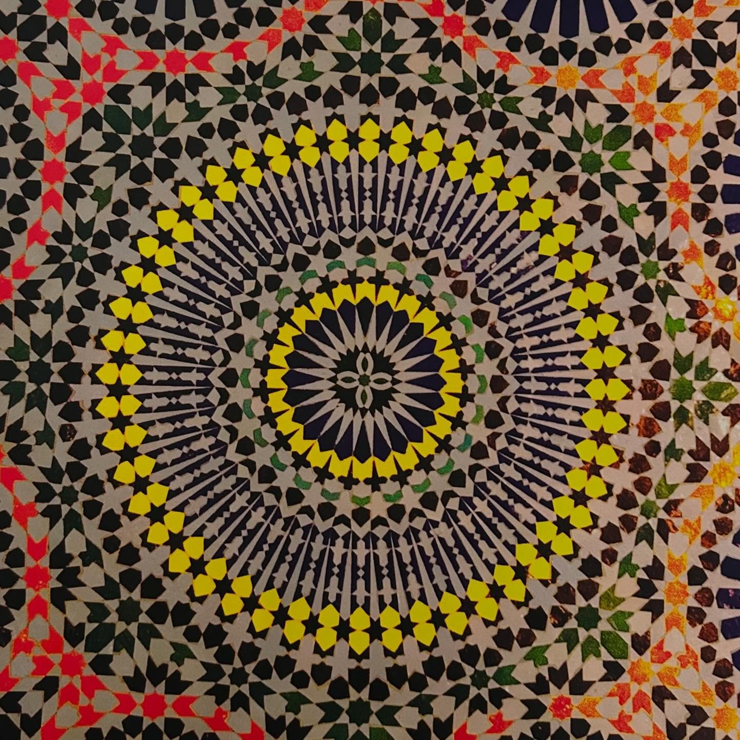 It begins with a photograph (first image) of a Moroccan tile. I print. I cut. I fold. I sew. I re-imagine.

I expect - its&rsquo; becoming will be one thing. A mandala (second image).
I&rsquo;m thinking - this will become a layering of mandalas - sha