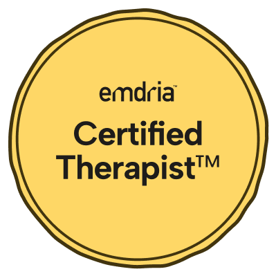 Golden badge with black border that says 'emdria Certified Therapist' in black text.