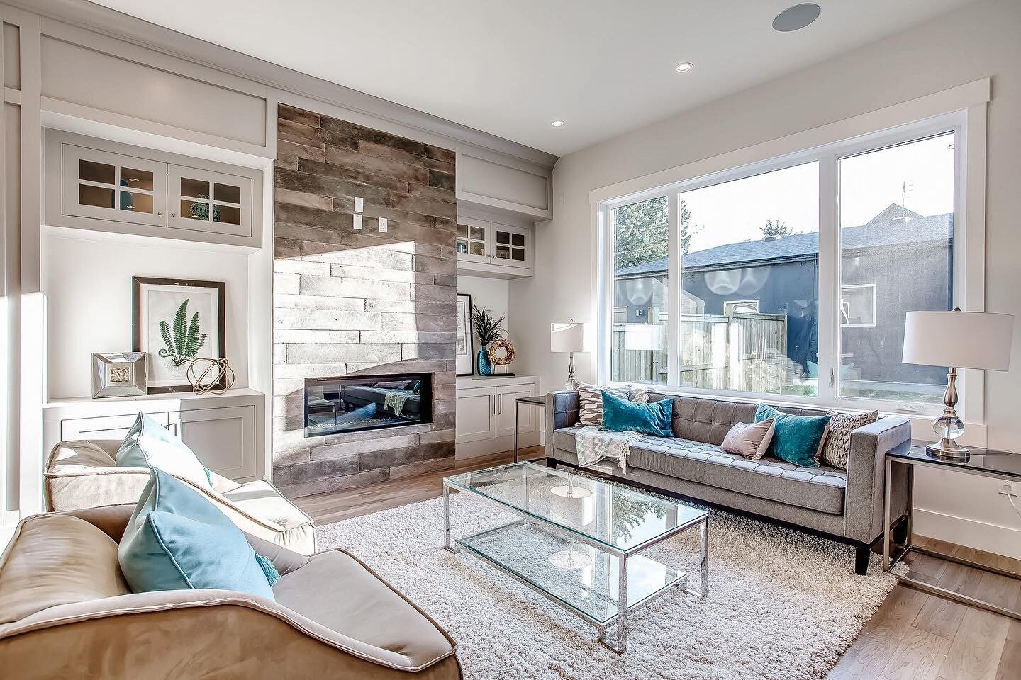 // This living room design of ours showcases a fantastic use of space with tons of huge windows for natural light, high end finishings and built-ins throughout. ⁣
⁣
⁣
⁣
⁣
⁣
#willowhavenhomes #willowhavendh #designerhome #yyccompany #yycsmallbusiness 