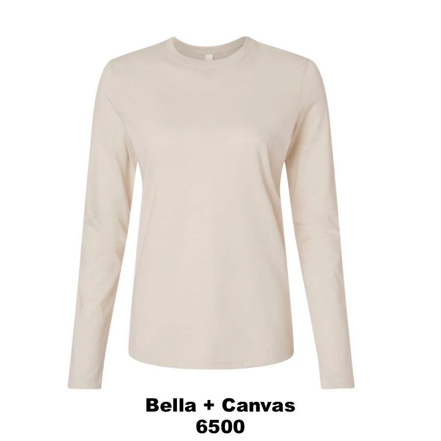 $25 Women’s Jersey Long Sleeve Tee Color Shown:  Heather Dust 
  Spec Sheet  📏