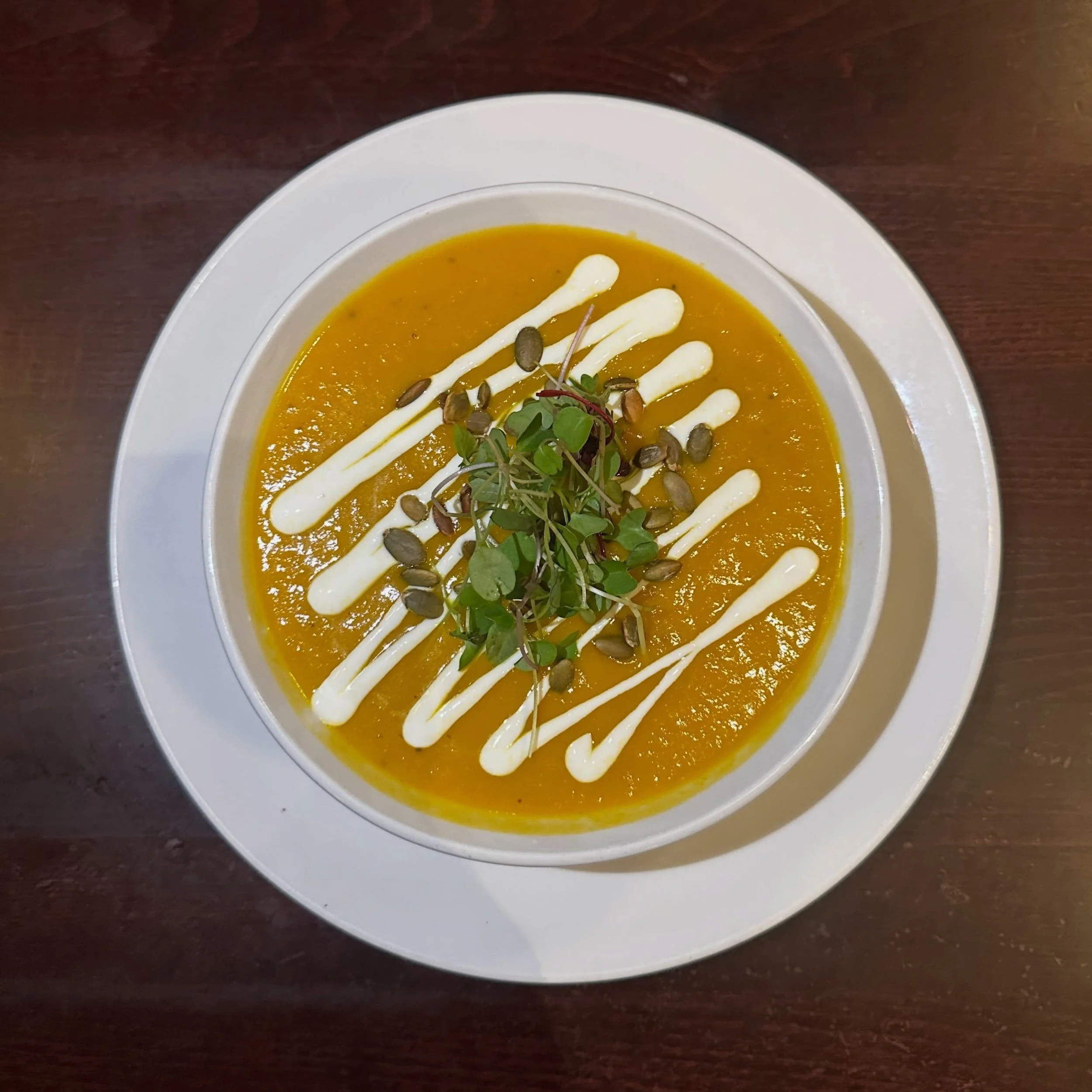 SOUP SEASON ALERT 🥕 We now have a delicious Carrot Miso Bisque topped with a heavy cream drizzle, pepitas, &amp; micro greens. Get it while it&rsquo;s hot!
.
.
 #themerc #themercsaratoga #downtownsaratoga #saratogasprings #discoversaratoga