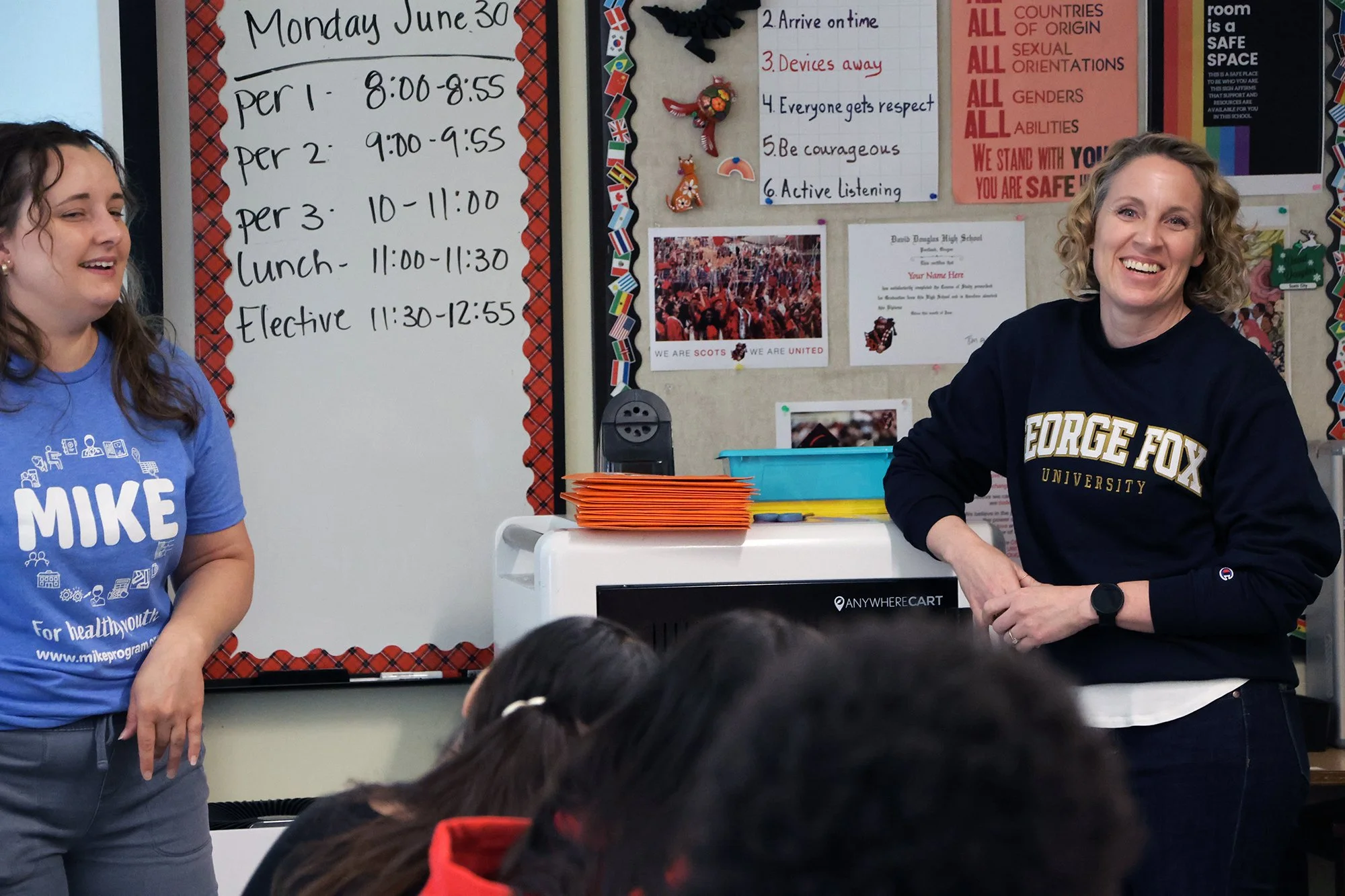 Amy Engilis (on right) presents health education career options for students.