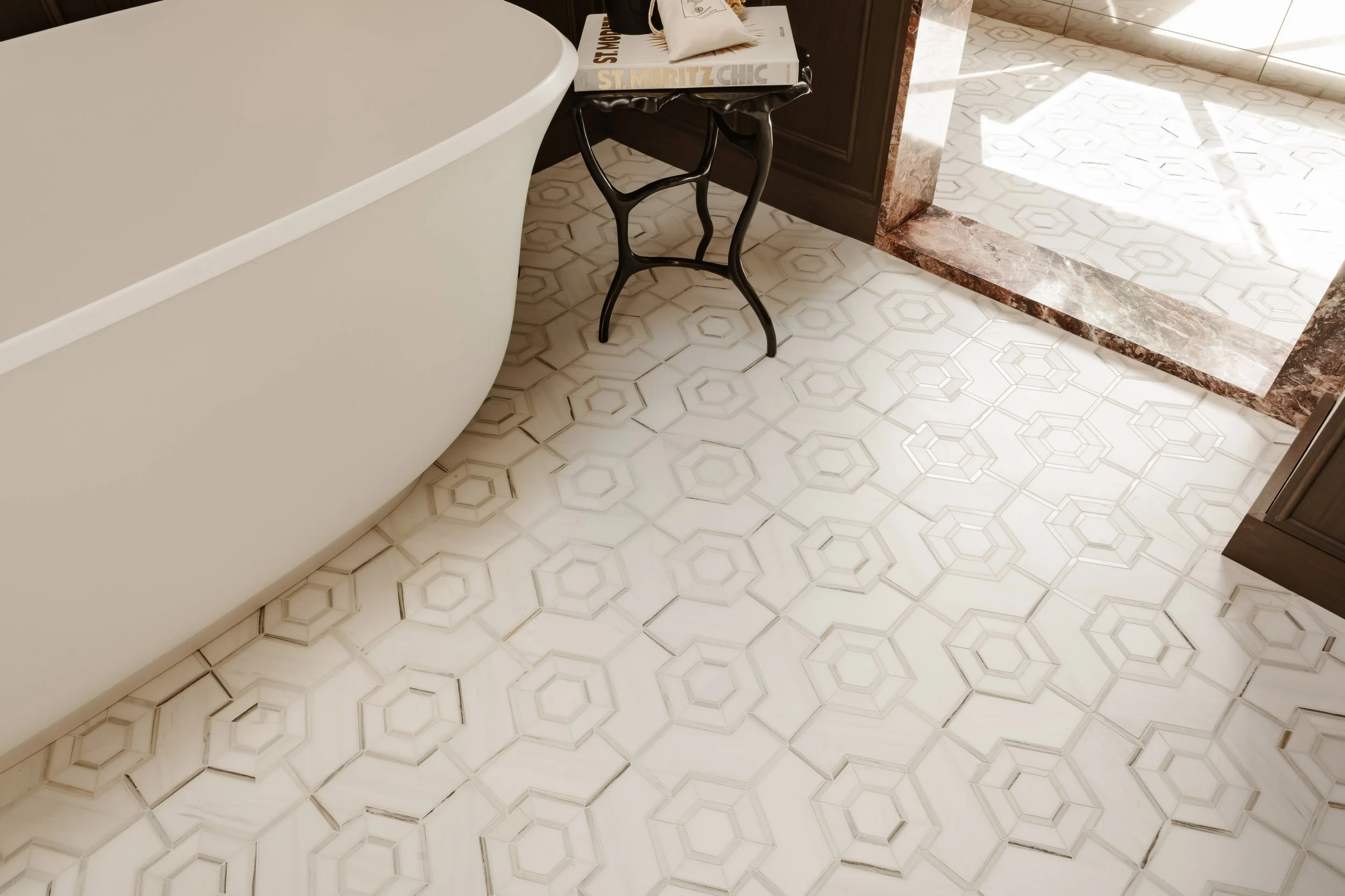 Stylized burgundy photo of a San Francisco home's luxury marble bathroom floor