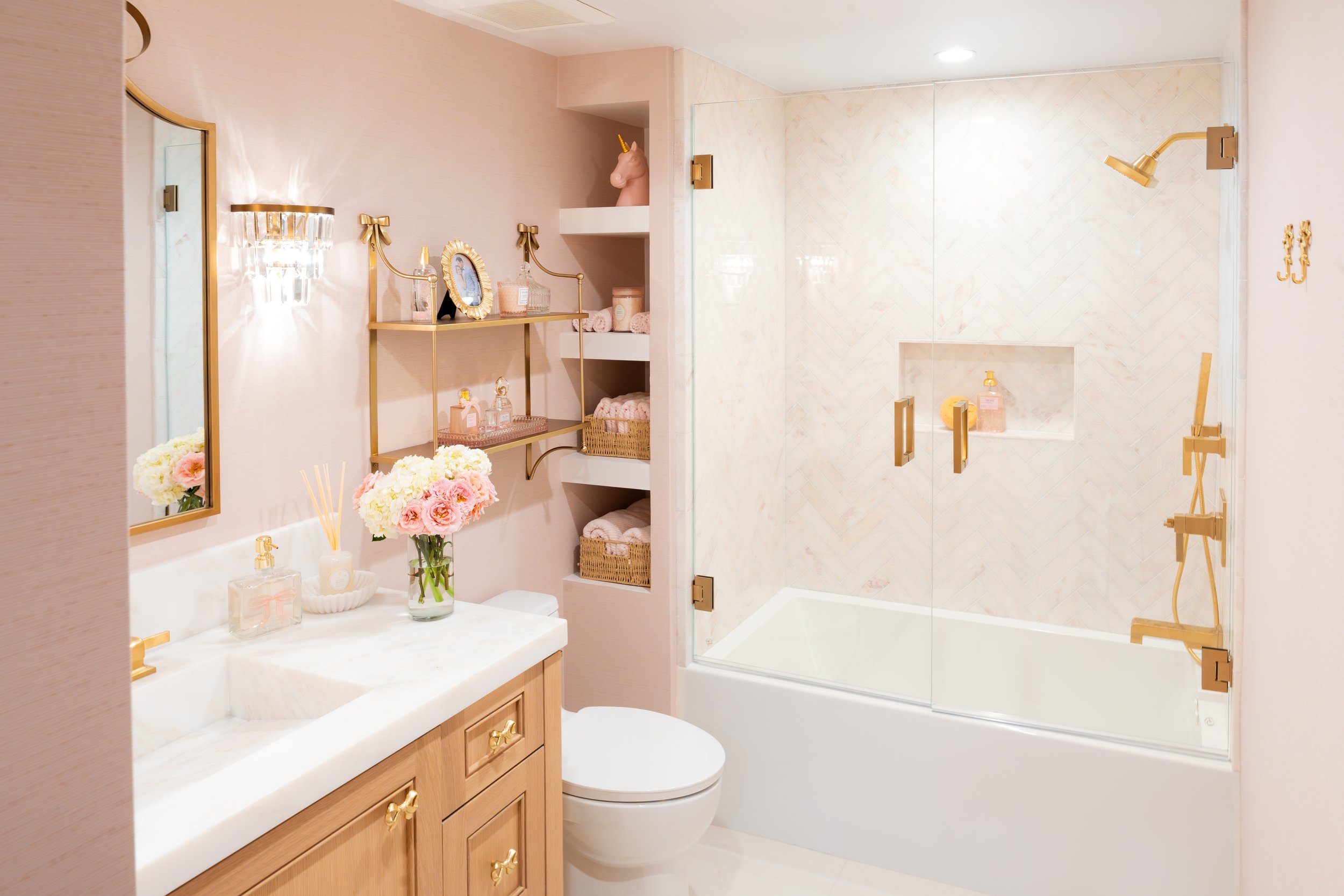 Pink and white luxury marble bathroom designed for a Newport beach home's girls' bathroom