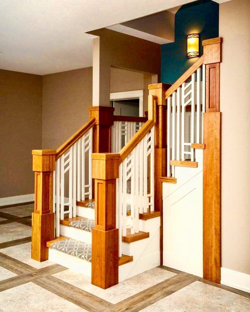 We matched the baluster to the wainscoting and trim as a nice contrast from the stained railing.