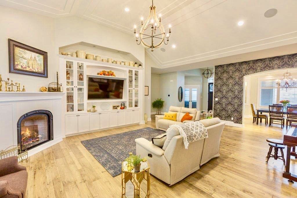 Lacquer sprayed cabinets and mantel, high-heat resistance paint sprayed on fireplace steel surround, smooth ceilings painted with flat latex, walls painted with low sheen latex, and wallpaper installed!
