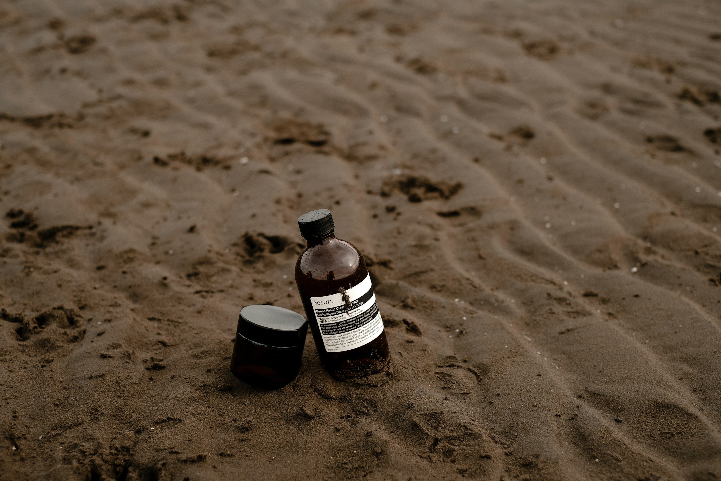 tanning lotion in the sand