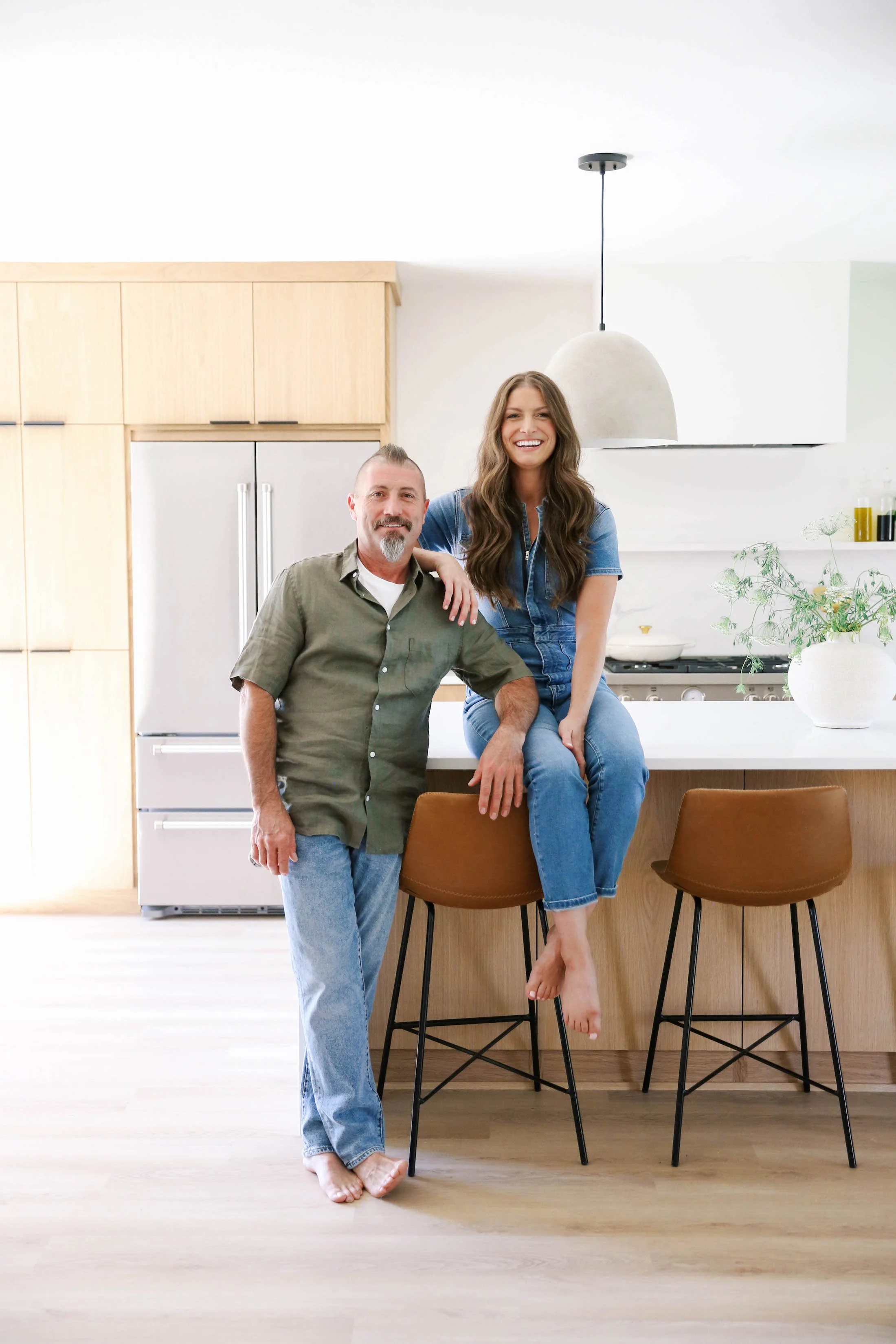 Ashley Kiely and construction manager Dave Vanamburgh in a completed Portland kitchen remodel.