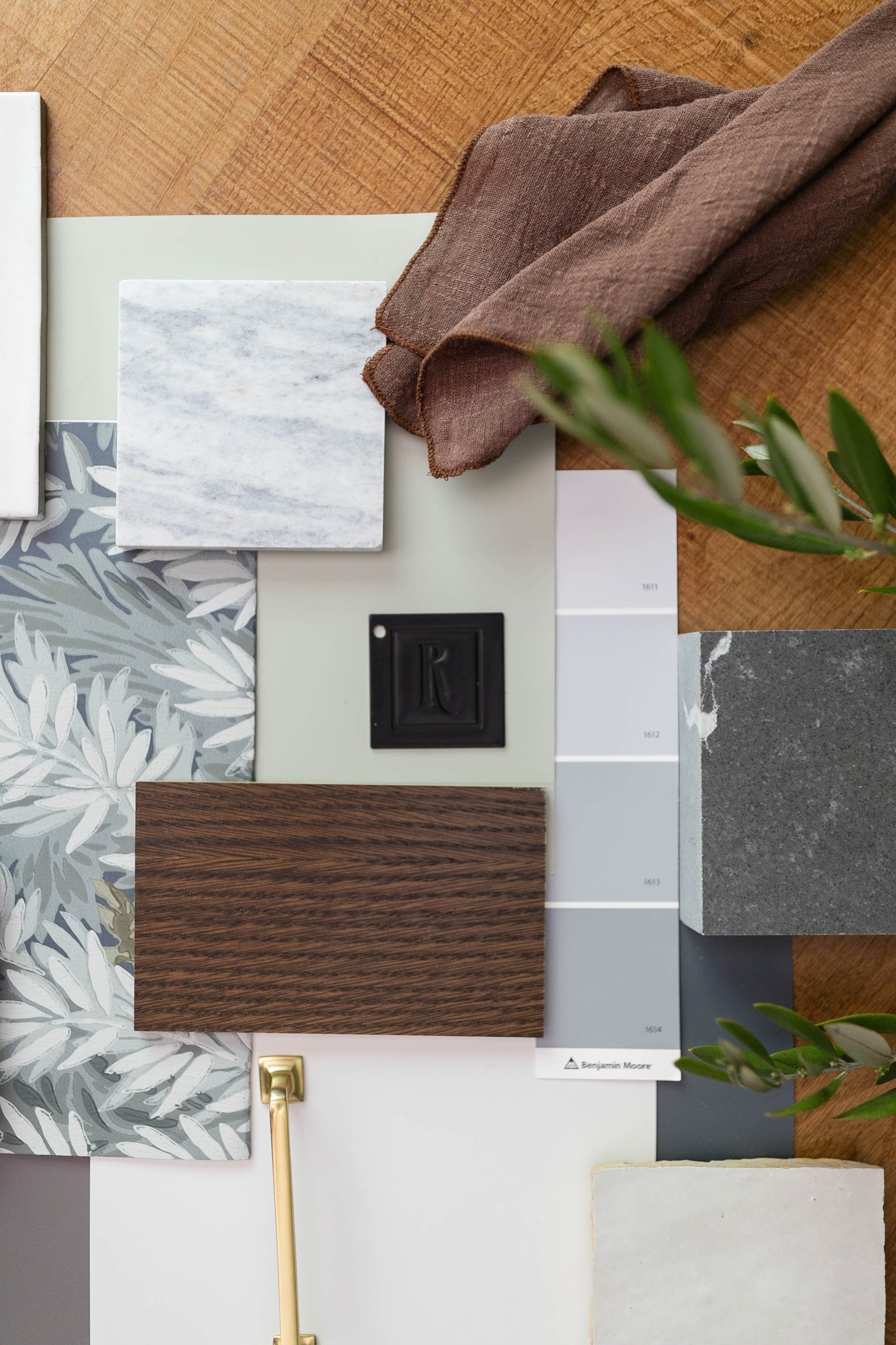 Interior design material palette with wood, stone, tile, textiles and finish selections by Ashley Kiely Living.