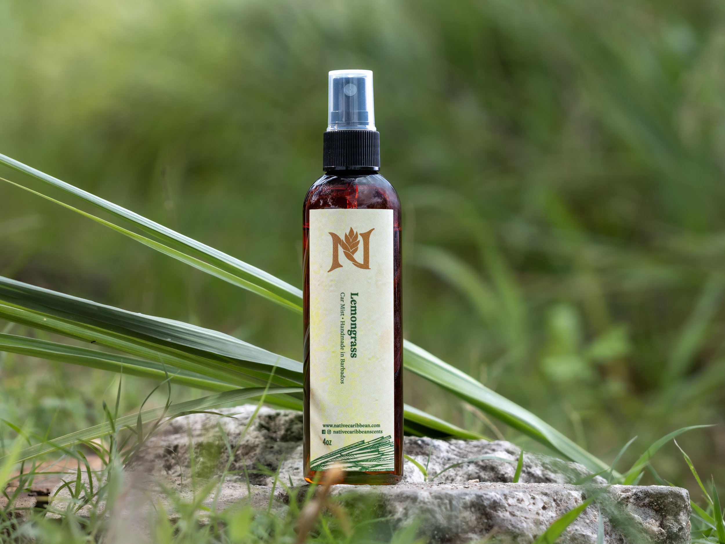  A natural lemon grass fragrance mist product photographed in a field of lemon grass.