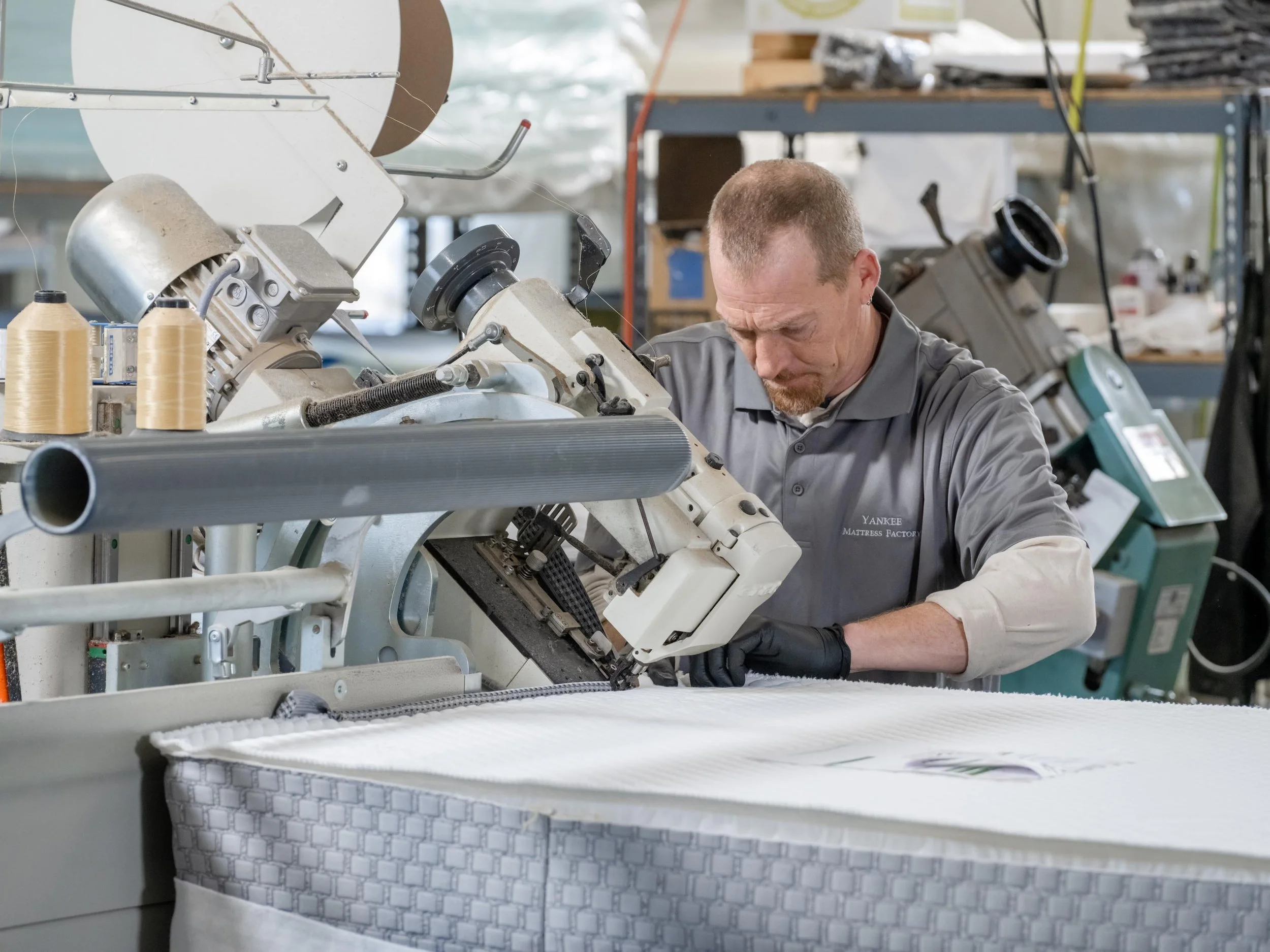 j81-Studios-industrial-manufacturing-photography-worker-sewing-a-mattress.jpg
