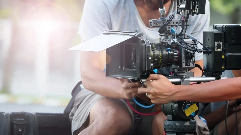 Filmfotograf med kamera