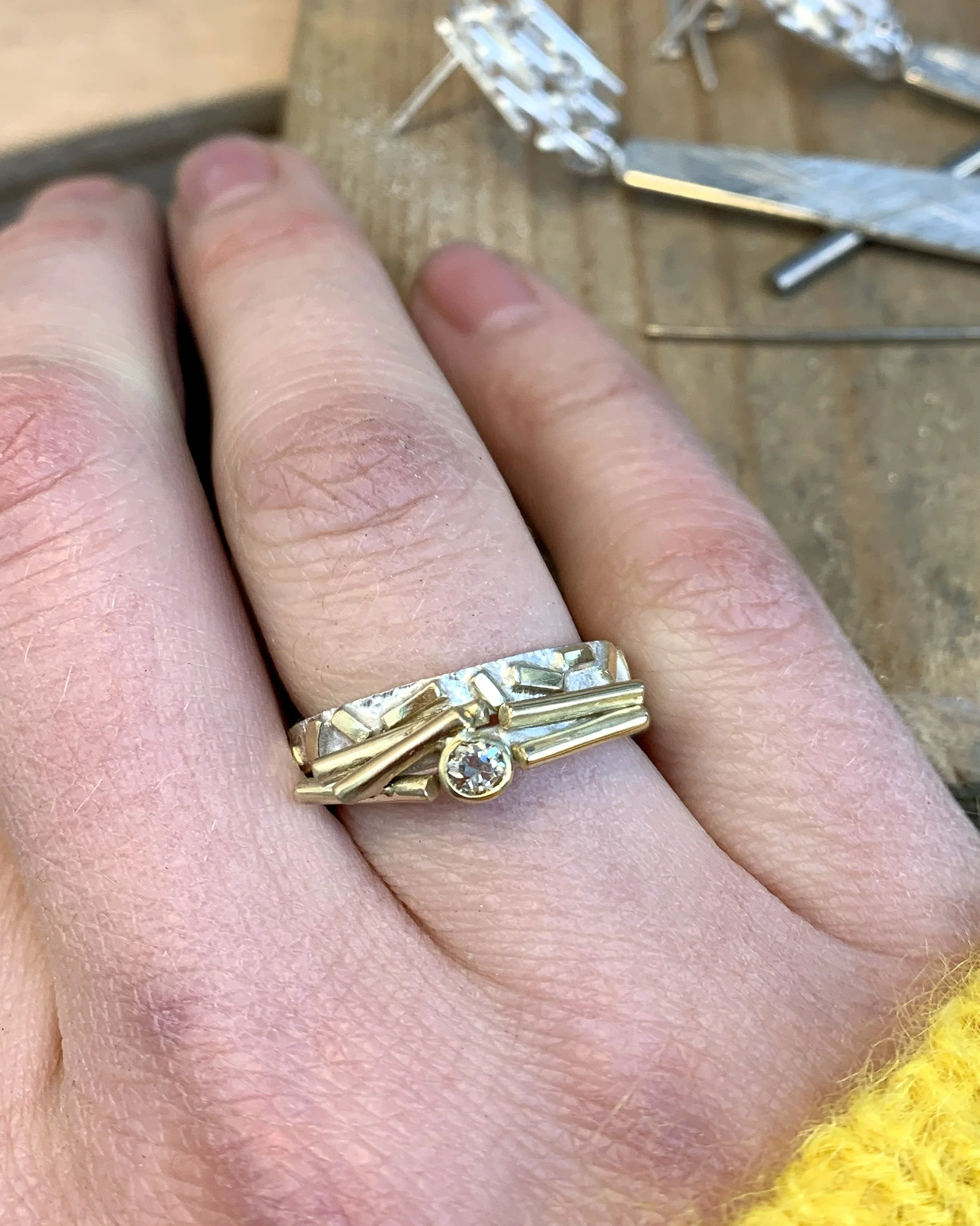 Ring stack in silver and 18ct gold with a central diamond