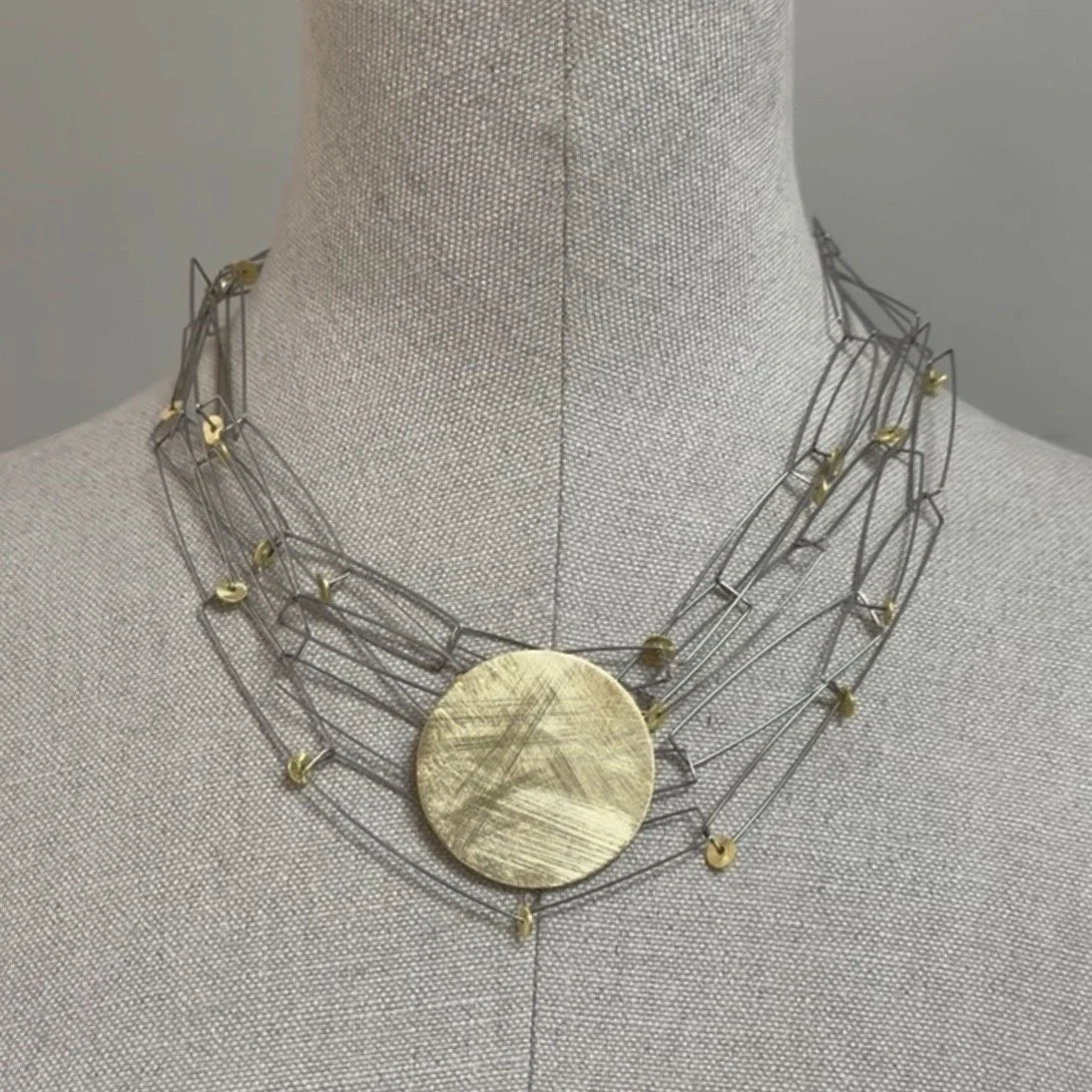 Statement necklace handmade in stainless steel and gold plated silver