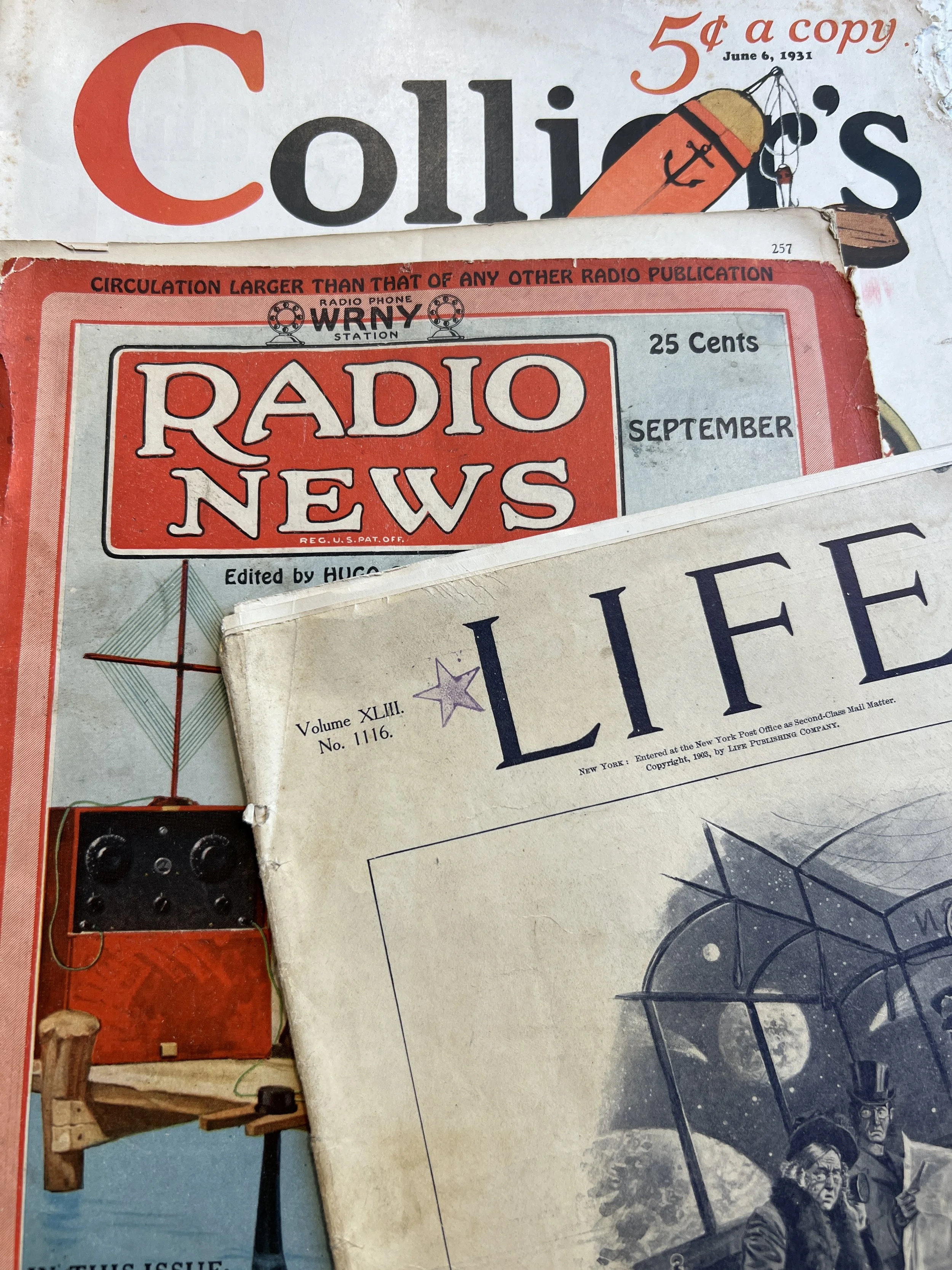Stack of vintage magazines including "Collier's," "Radio News," and "Life," dated June 6, 1931.