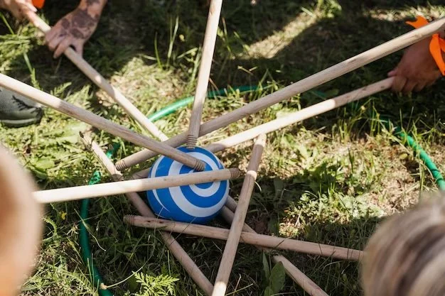 teambuilding game dowels with ball