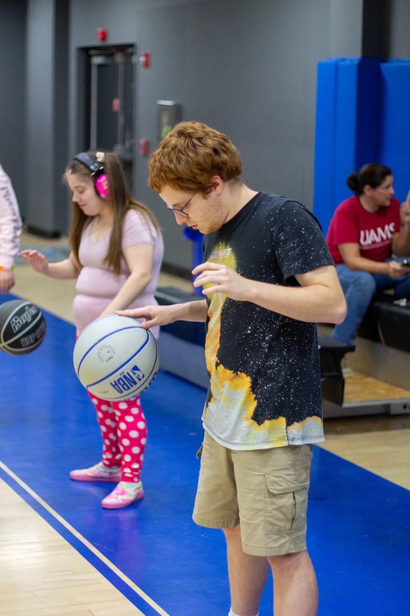 boy and girl bouncing a basketball