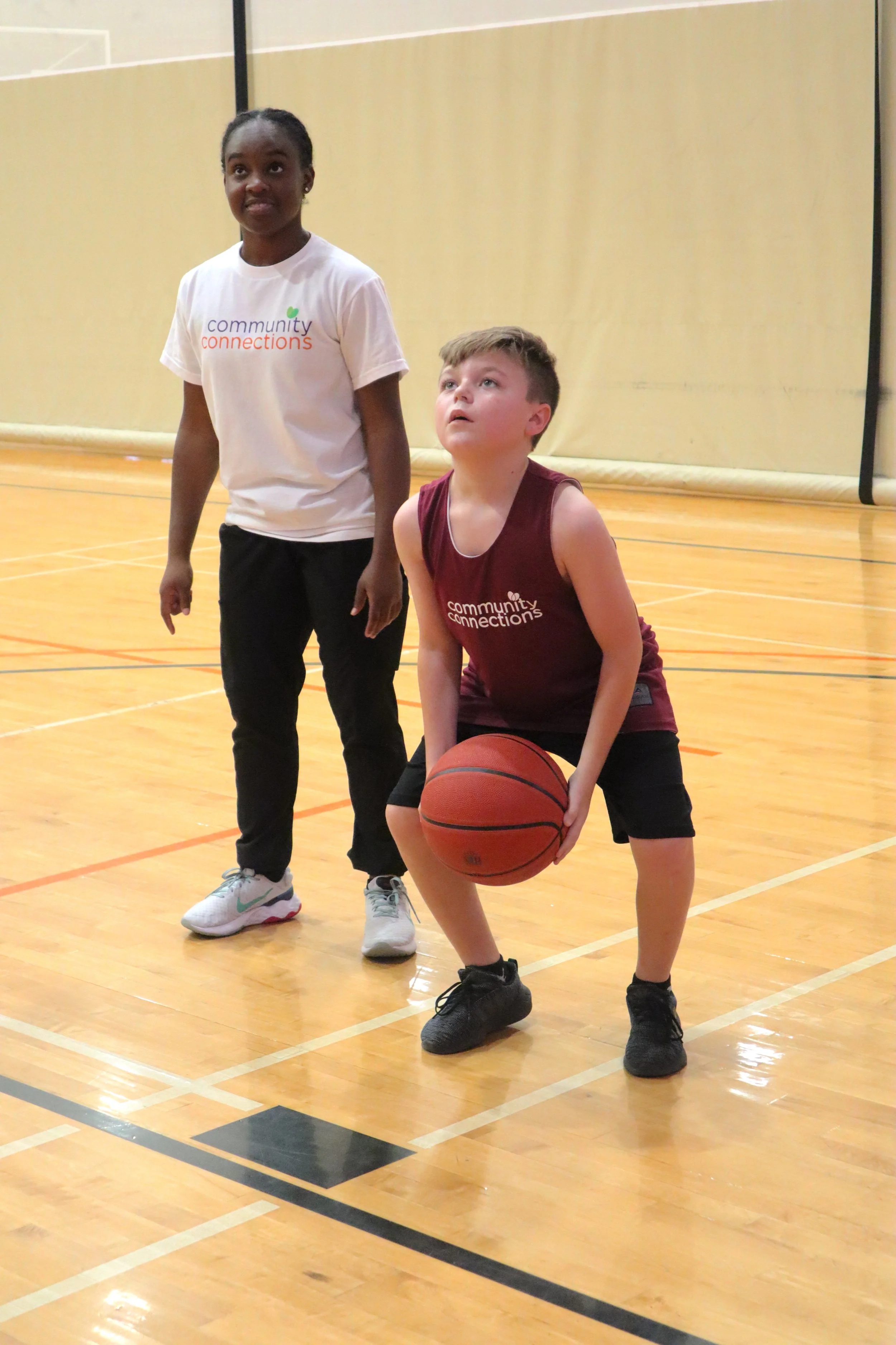 boy shooting a basketball