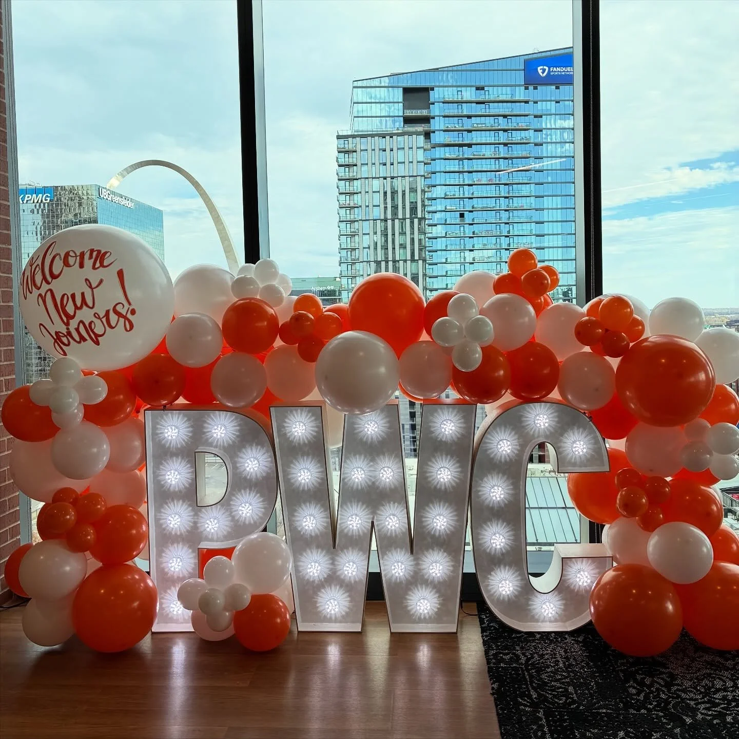 Balloons, bright lights, and that STL skyline 🌆✨ The perfect welcome for PWC&rsquo;s new joiners! #balloons #marquee #balloonstl #balloondecoration