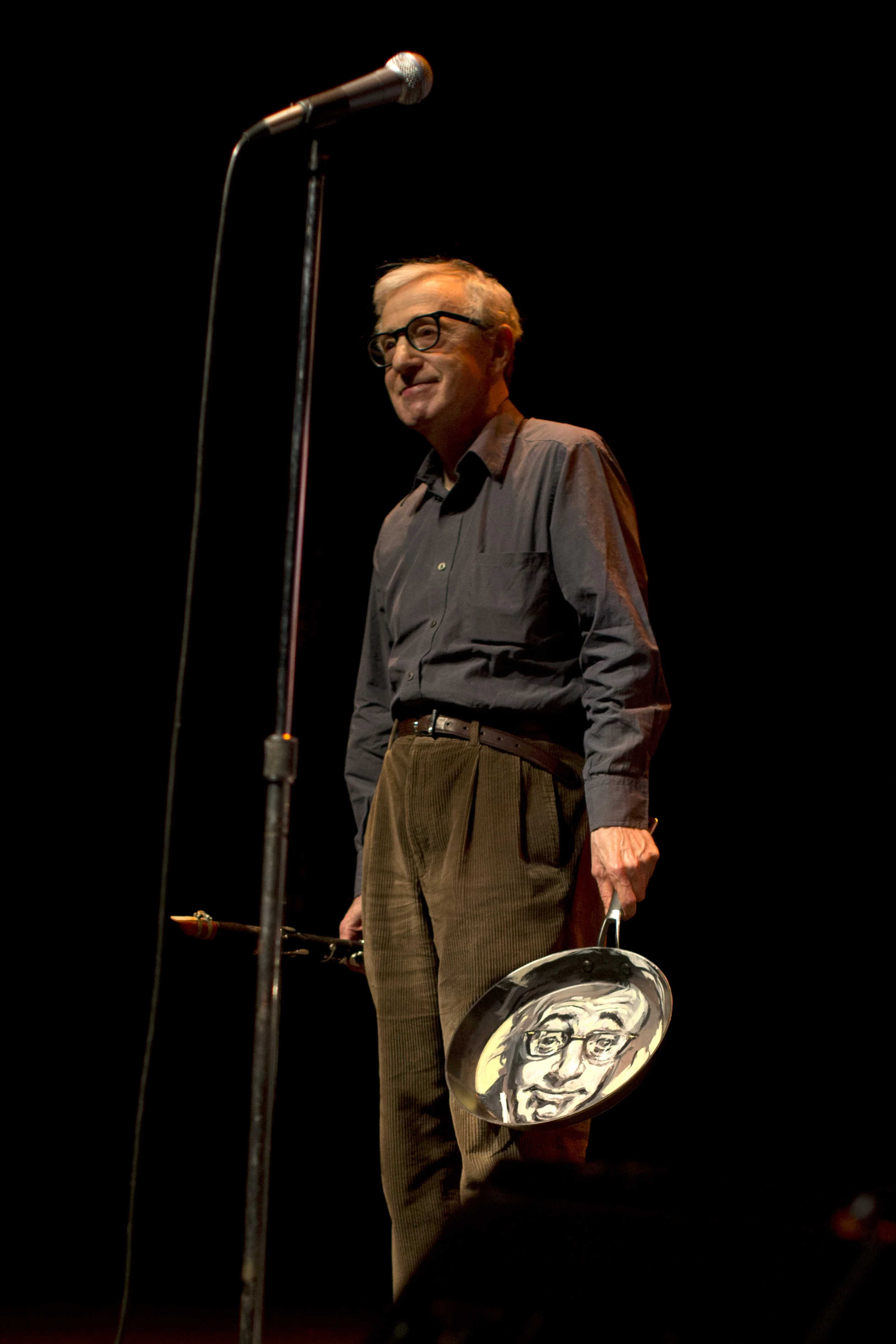 Woody Allen with his portrait on stage at Royce Hall