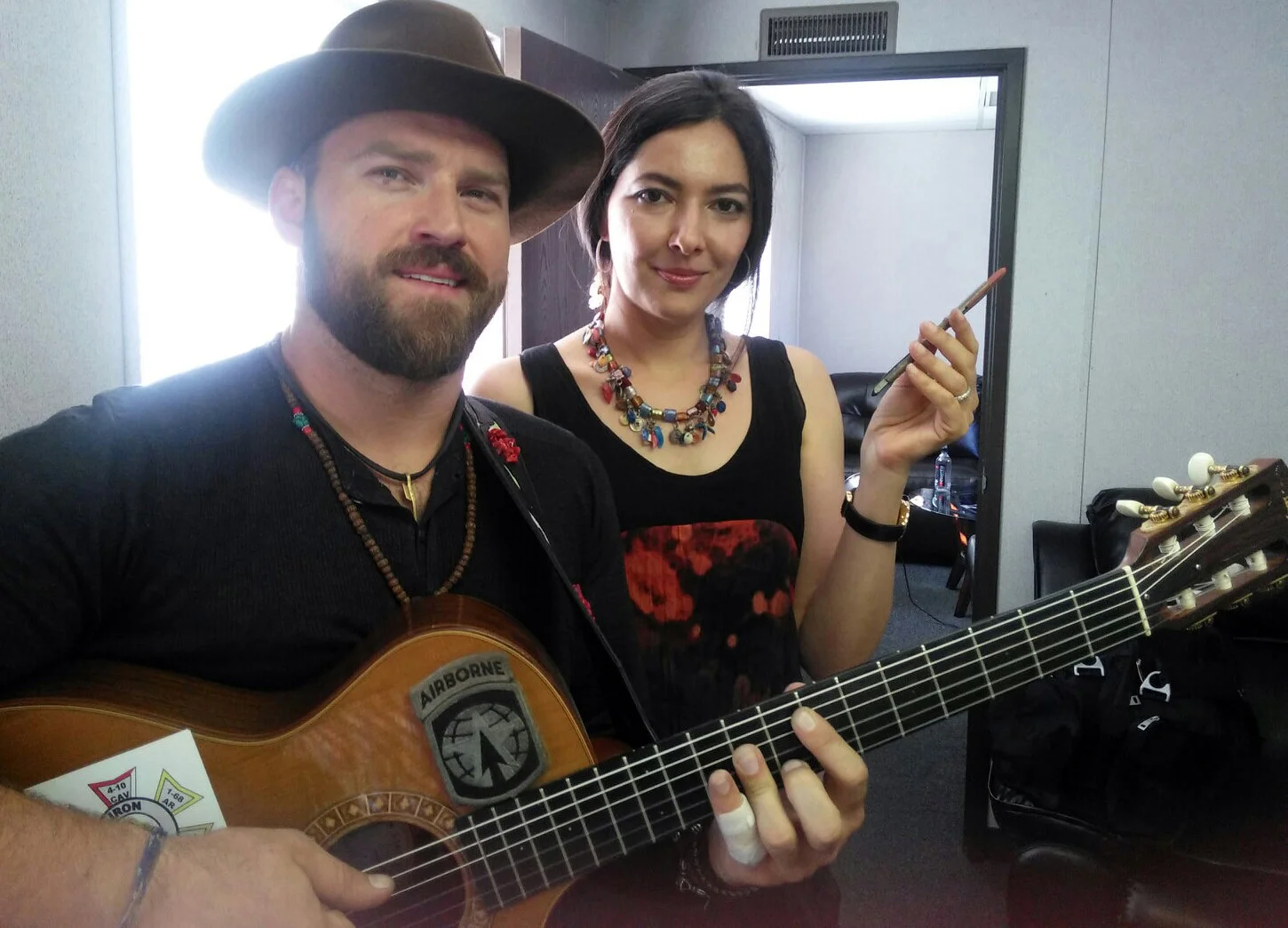 with Zac Brown posing for his commission