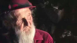 Dugout Dick

Image: a high-contrast image of an elderly white man with a long white beard. He is wearing a red shirt and a red hardhat and is staring off to the side and into the light.
